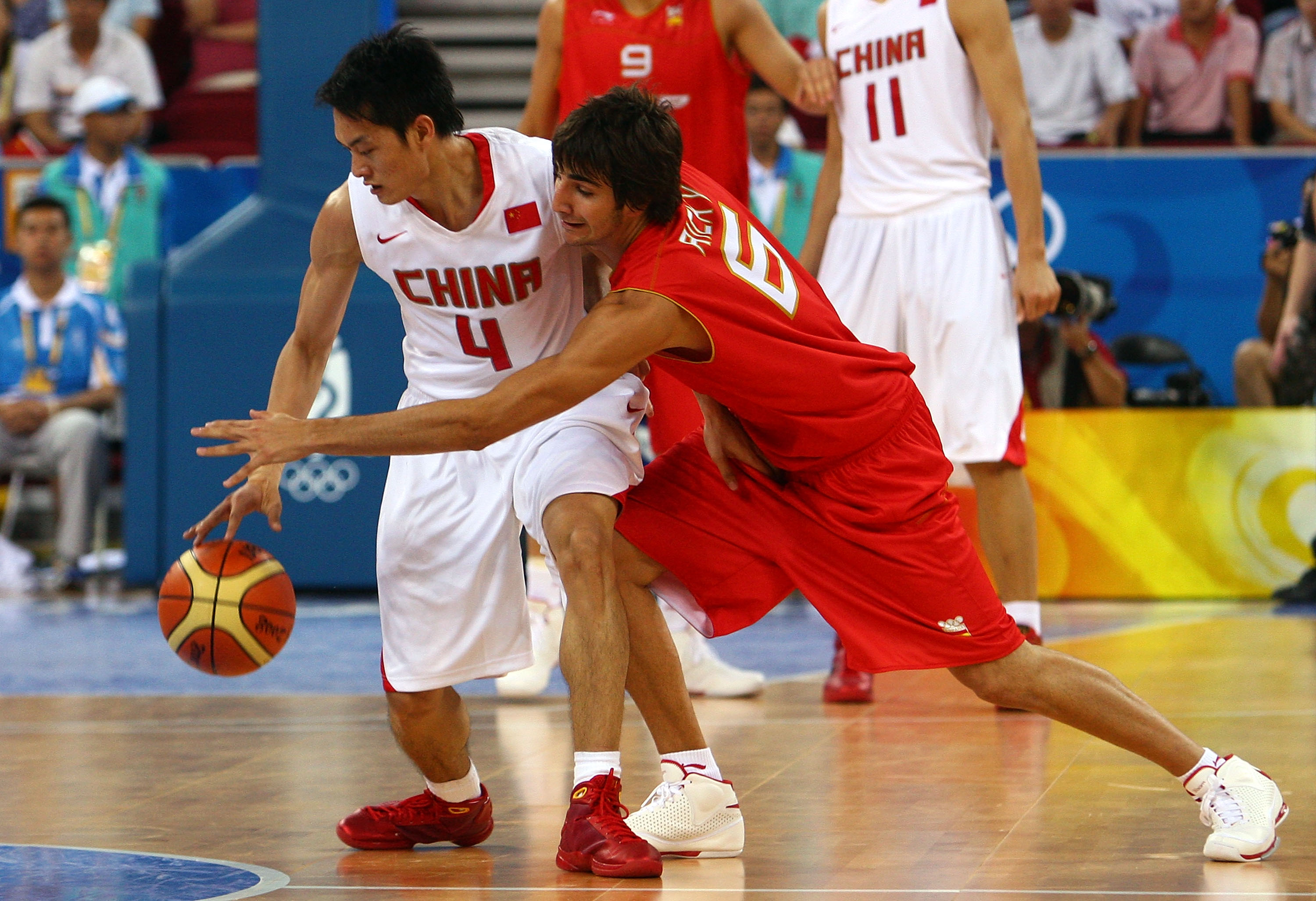 BEIJING - AUGUST 12:  (R-L) Ricky Rubio #6 of Spain attempts to steal the ball from Chen Jianghua #4 of China in the preliminary basketball game held at the Beijing Olympic Basketball Gymnasium during Day 4 of the Beijing 2008 Olympic Games on August 12,