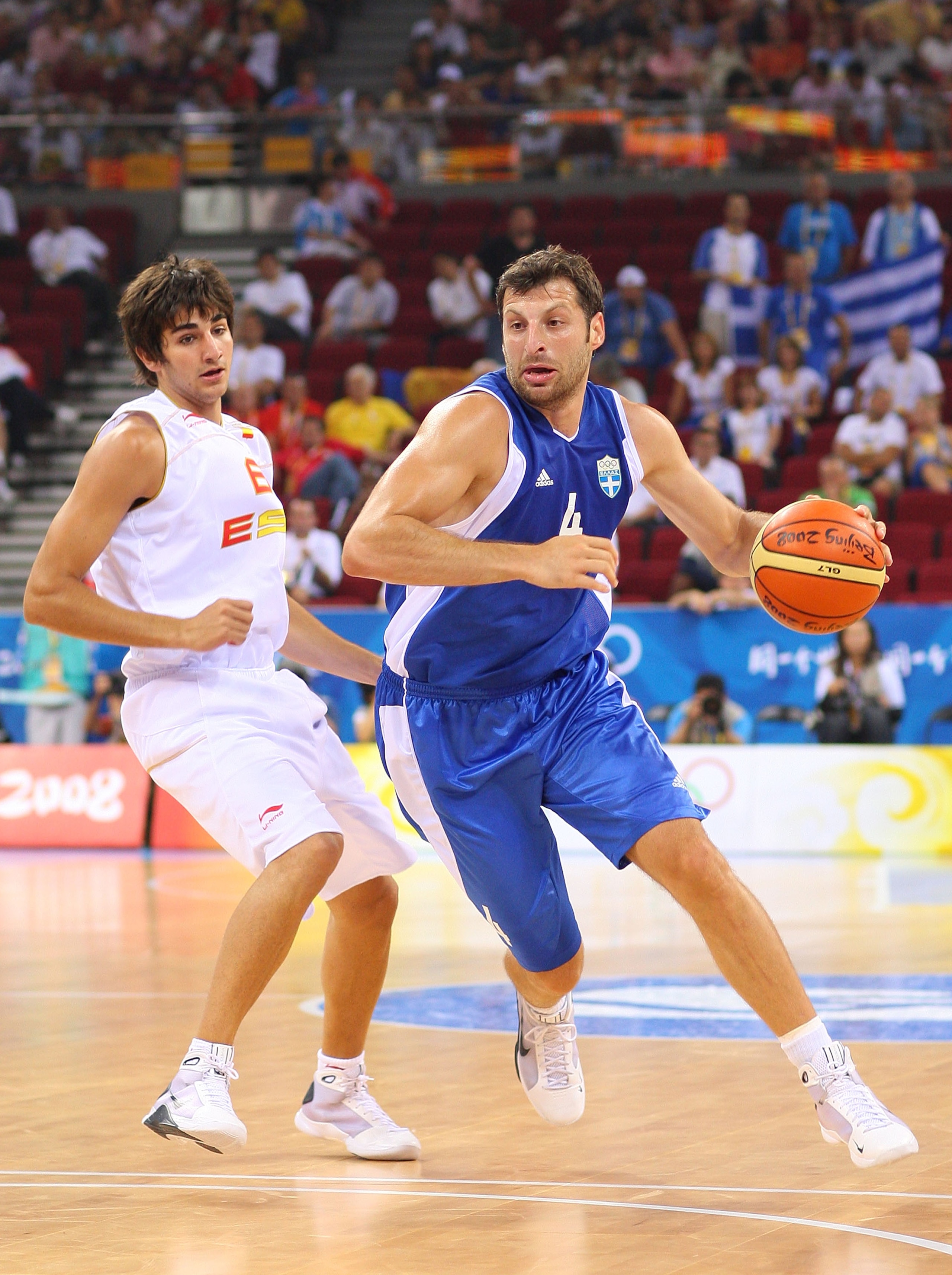BEIJING - AUGUST 10:  Theodoros Papaloukas #4 of Greece drives on Ricky Rubio #6 of Spain during the day 2 preliminary game at the Beijing 2008 Olympic Games in the Beijing Olympic Basketball Gymnasium on August 10, 2008 in Beijing, China.  (Photo by Phil
