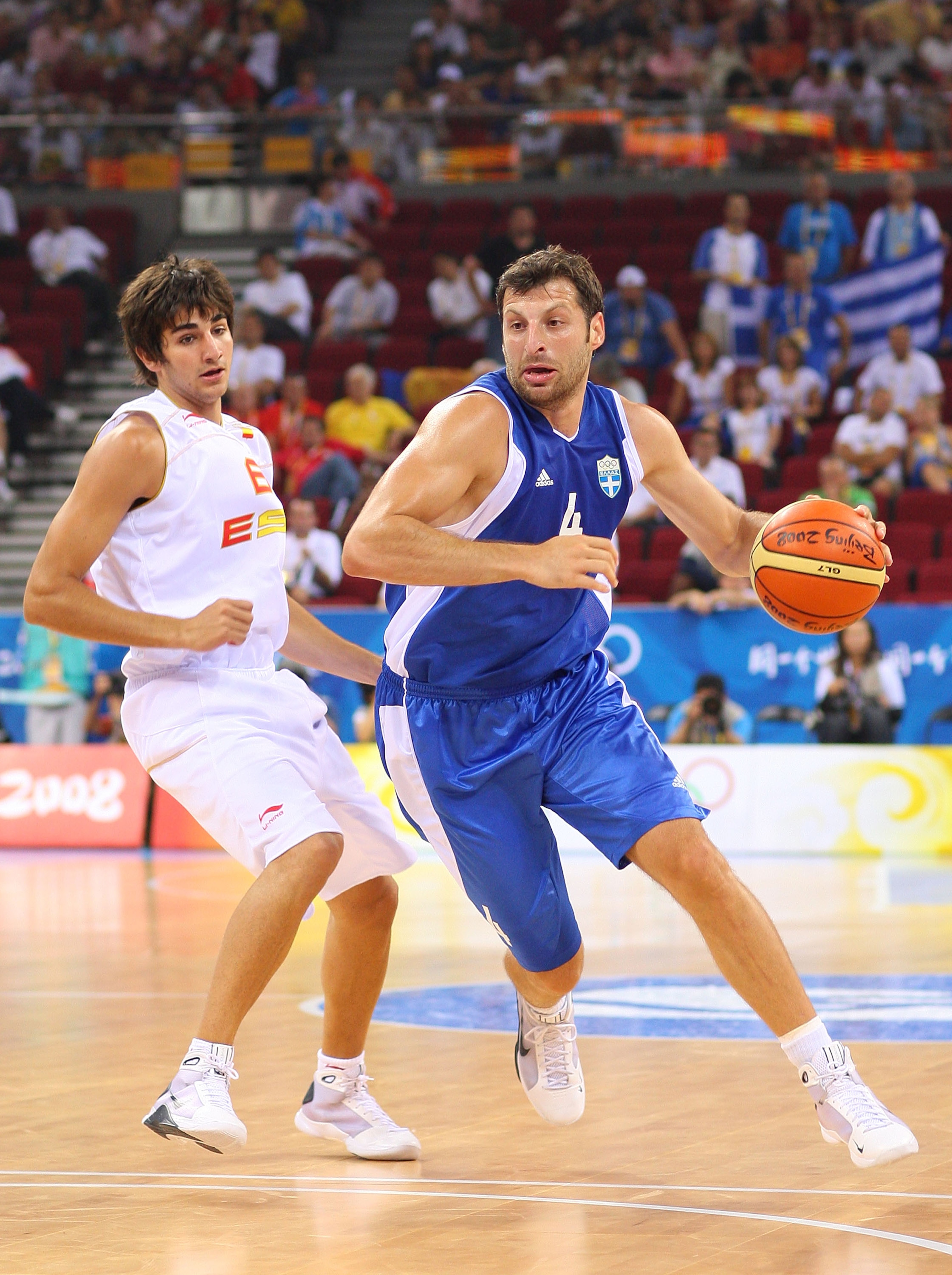 BEIJING - AUGUST 10:  Theodoros Papaloukas #4 of Greece drives on Ricky Rubio #6 of Spain during the day 2 preliminary game at the Beijing 2008 Olympic Games in the Beijing Olympic Basketball Gymnasium on August 10, 2008 in Beijing, China.  (Photo by Phil