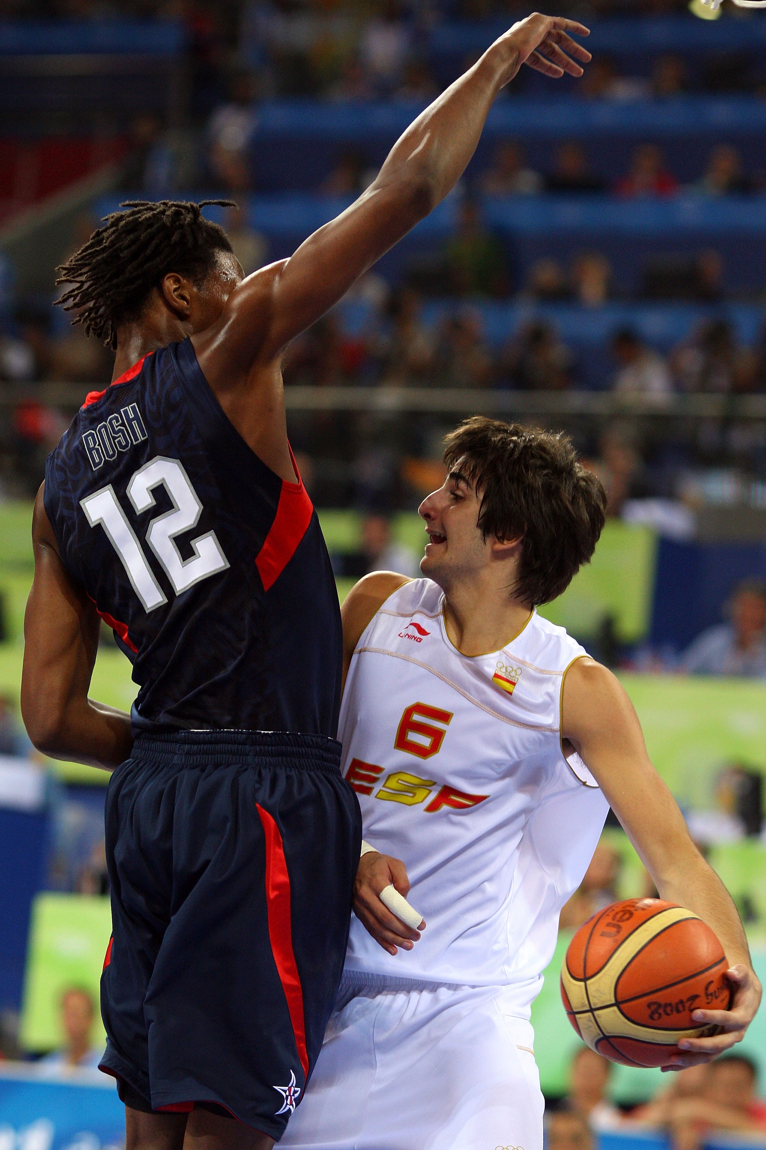 BEIJING - AUGUST 24:  Ricky Rubio #6 of Spain moves against the defense of Chris Bosh #12 of the United States in the gold medal game during Day 16 of the Beijing 2008 Olympic Games at the Beijing Olympic Basketball Gymnasium on August 24, 2008 in Beijing