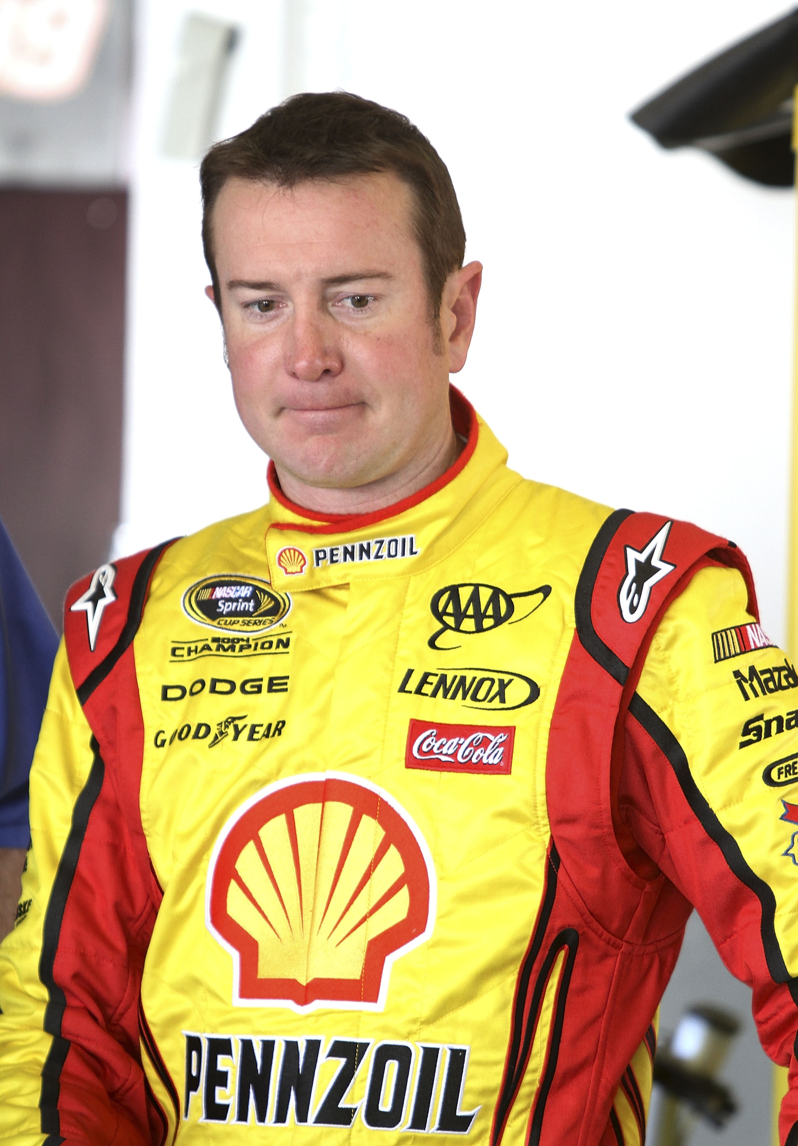 DAYTONA BEACH, FL - JANUARY 20:  Kurt Busch, driver of the #22 Shell/Pennzoil Dodge waits in the garage during testing at Daytona International Speedway on January 20, 2011 in Daytona Beach, Florida.  (Photo by Jerry Markland/Getty Images for NASCAR)