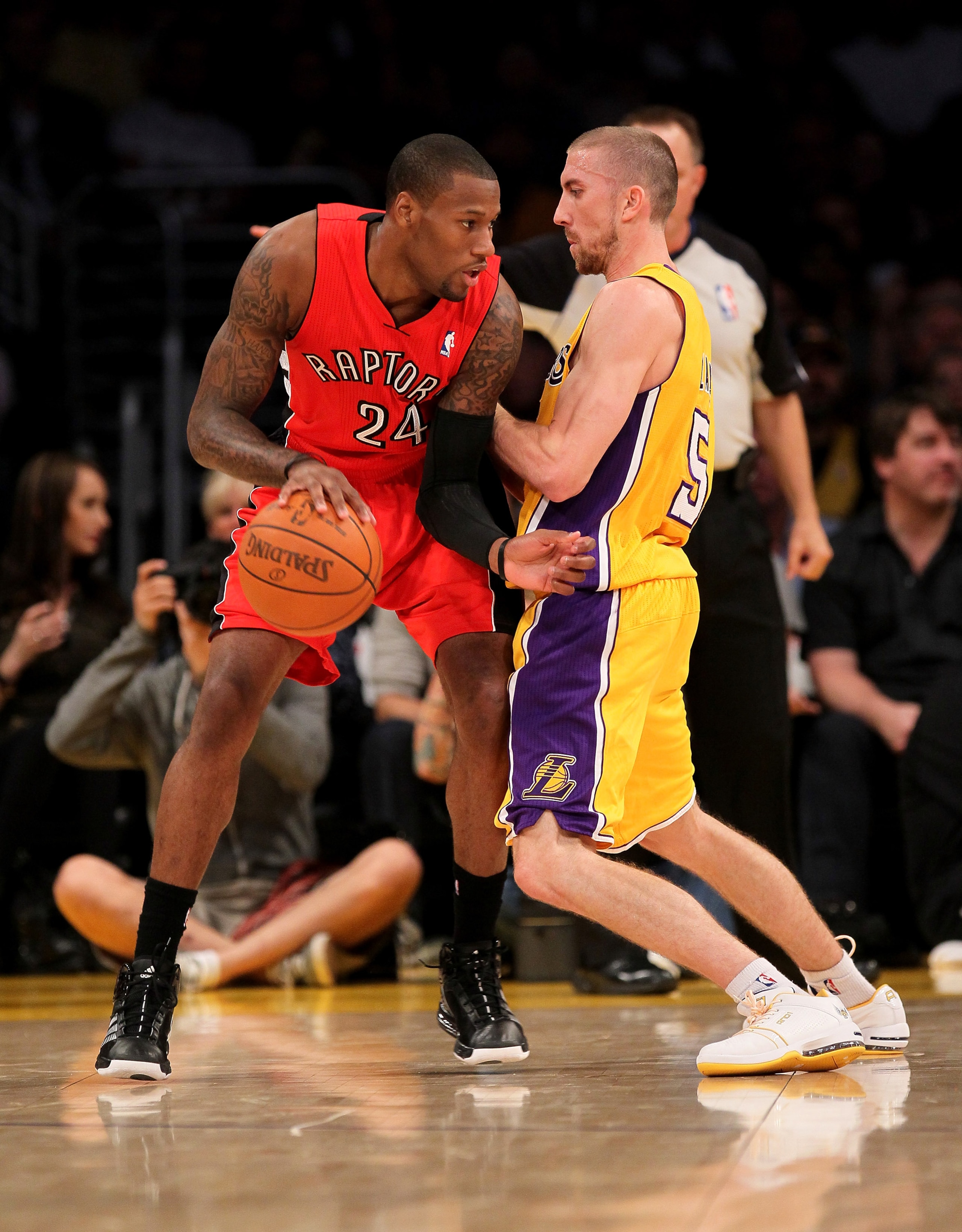 LOS ANGELES - NOVEMBER 5: Sonny Weims #24 of the Toronto Raptors controls the ball against Steve Blake #5 of the Los Angeles Lakers at Staples Center on November 5, 2010 in Los Angeles, California. NOTE TO USER: User expressly acknowledges and agrees t LOS ANGELES - NOVEMBER 5: Sonny Weims #24 of the Toronto Raptors controls the ball against Steve Blake #5 of the Los Angeles Lakers at Staples Center on November 5, 2010 in Los Angeles, California. NOTE TO USER: User expressly acknowledges and agrees t