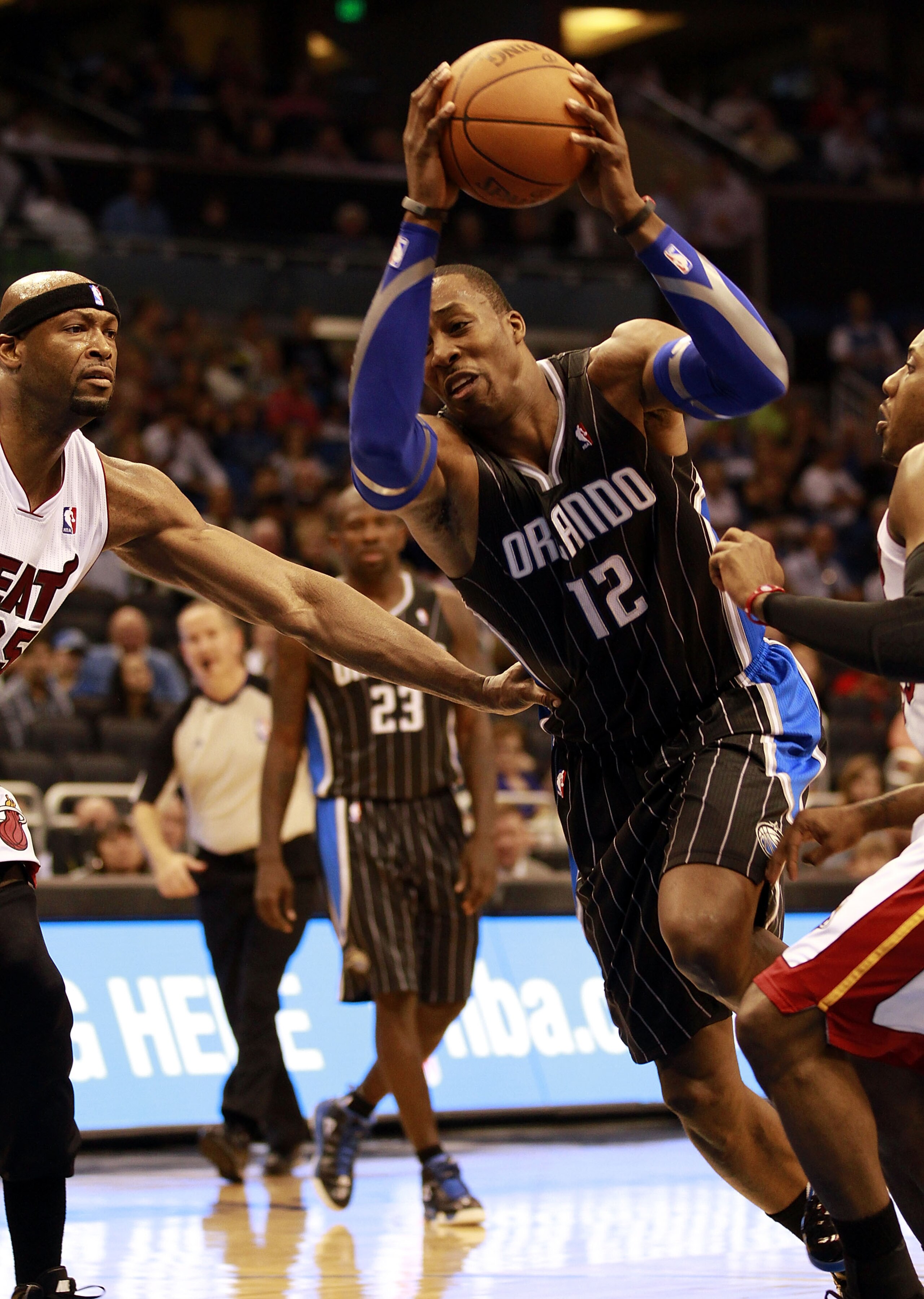 ORLANDO, FL - FEBRUARY 03: Center Dwight Howard #12 of the Orlando Magic drives against the Miami Heat at Amway Arena on February 3, 2011 in Orlando, Florida. NOTE TO USER: User expressly acknowledges and agrees that, by downloading and or using this pho ORLANDO, FL - FEBRUARY 03: Center Dwight Howard #12 of the Orlando Magic drives against the Miami Heat at Amway Arena on February 3, 2011 in Orlando, Florida. NOTE TO USER: User expressly acknowledges and agrees that, by downloading and or using this pho