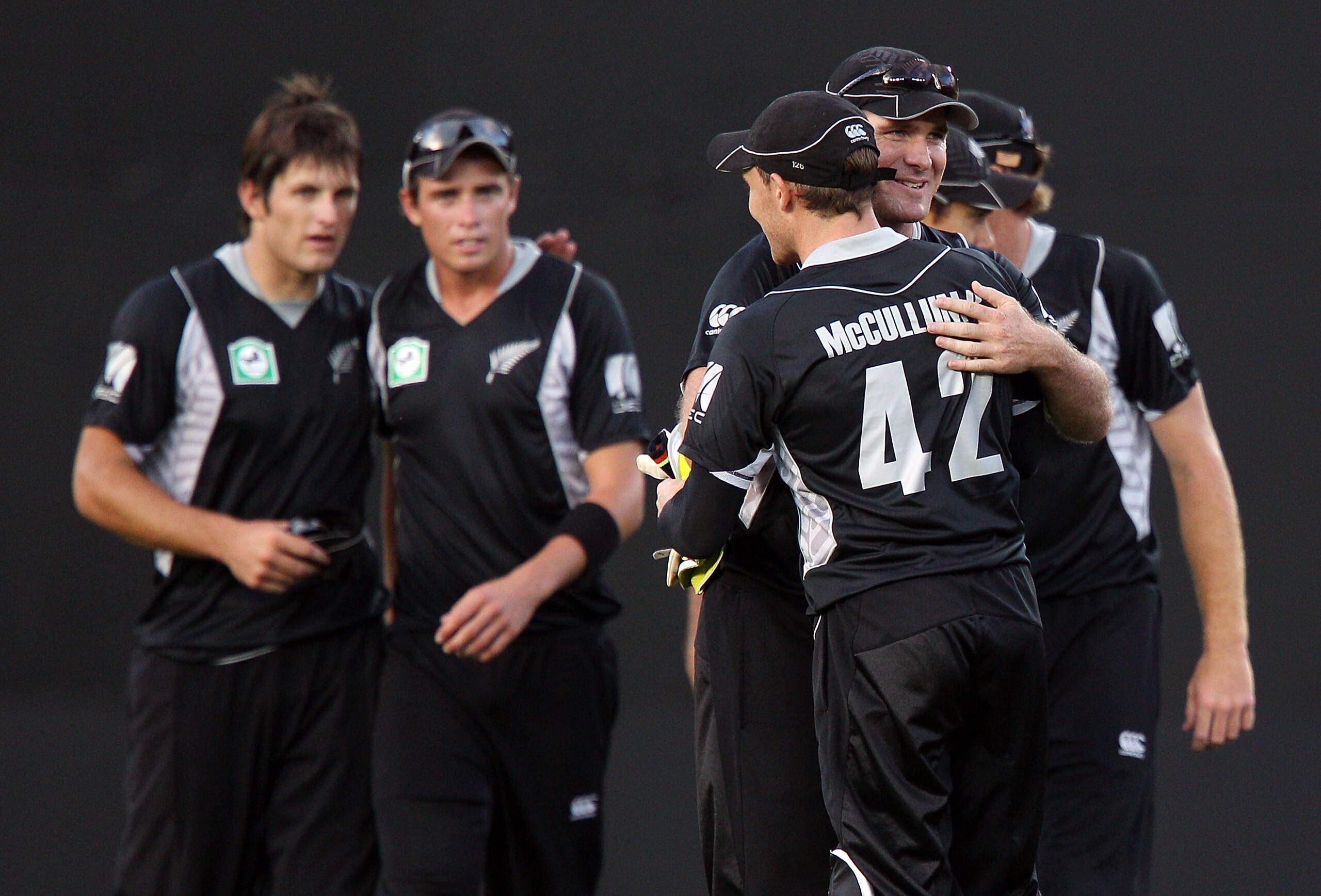 AUCKLAND, NEW ZEALAND - FEBRUARY 05:  L to R, Hamish Bennett, Tim Southee, Brendon McCullum and Jamie How of the Black Caps celebrate thier win during game six of the one day series between New Zealand and Pakistan at Eden Park on February 5, 2011 in Auck