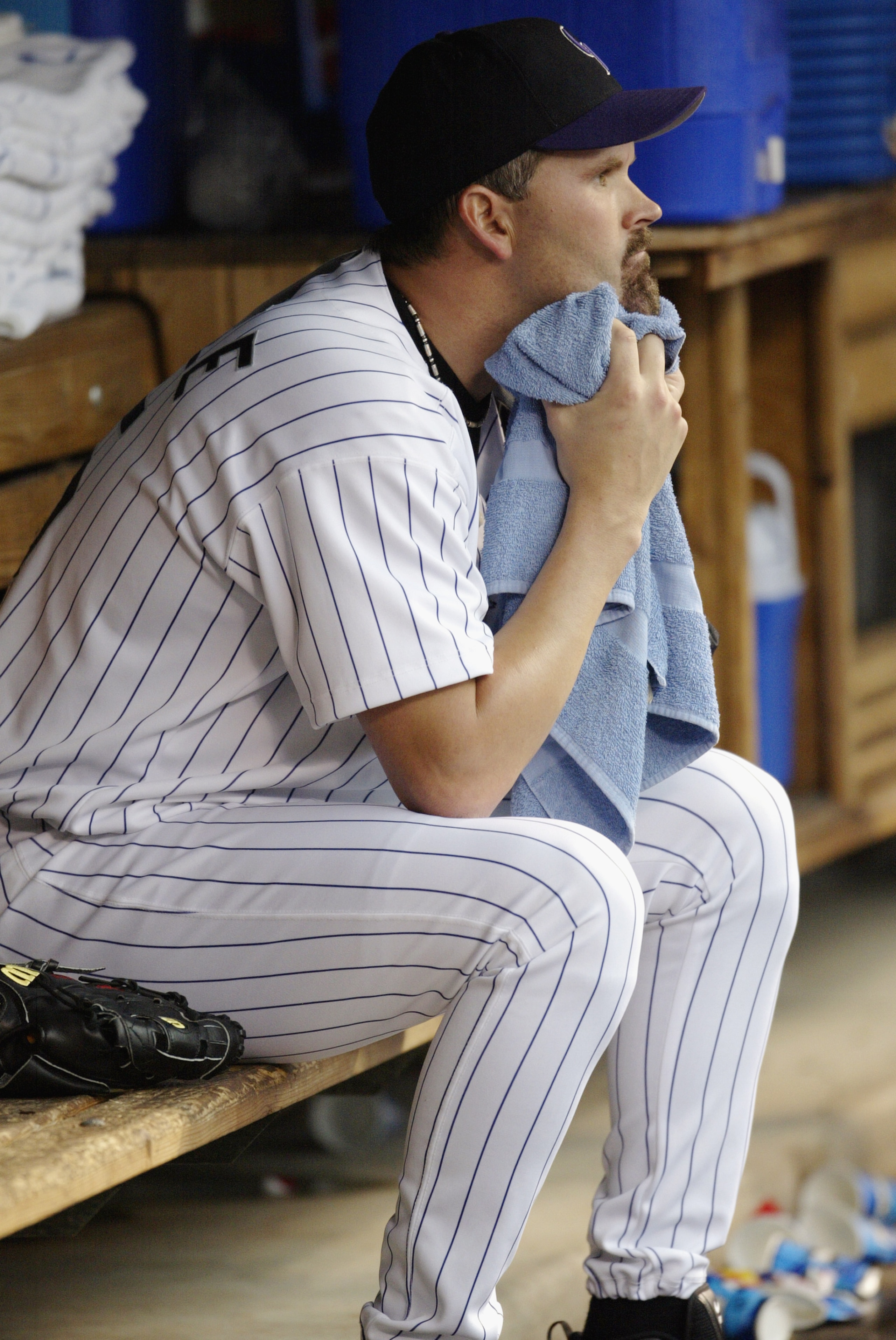 DENVER - JUNE 17:  Starting pitcher Denny Neagle #15 of the Colorado Rockies watches the game from the dugout in the bottom half of the first inning of the game against the San Diego Padres at Coors Field on June 17, 2003 in Denver, Colorado.  The Padres