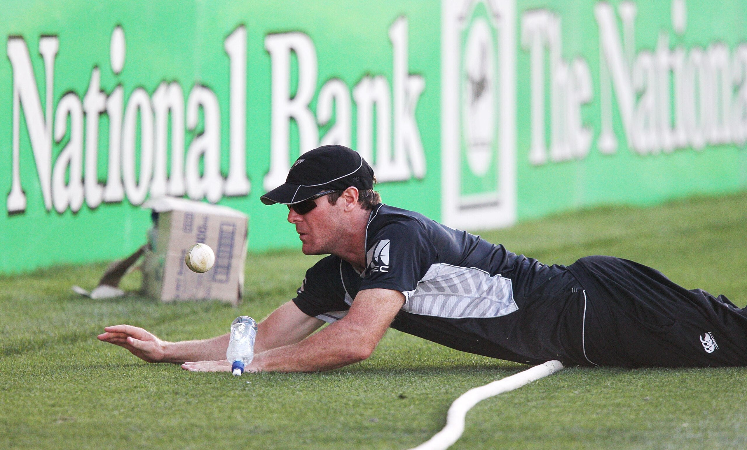 AUCKLAND, NEW ZEALAND - FEBRUARY 05:  Jamie How of the Black Caps fails to field the ball before hitting the boundary during game six of the one day series between New Zealand and Pakistan at Eden Park on February 5, 2011 in Auckland, New Zealand.  (Photo