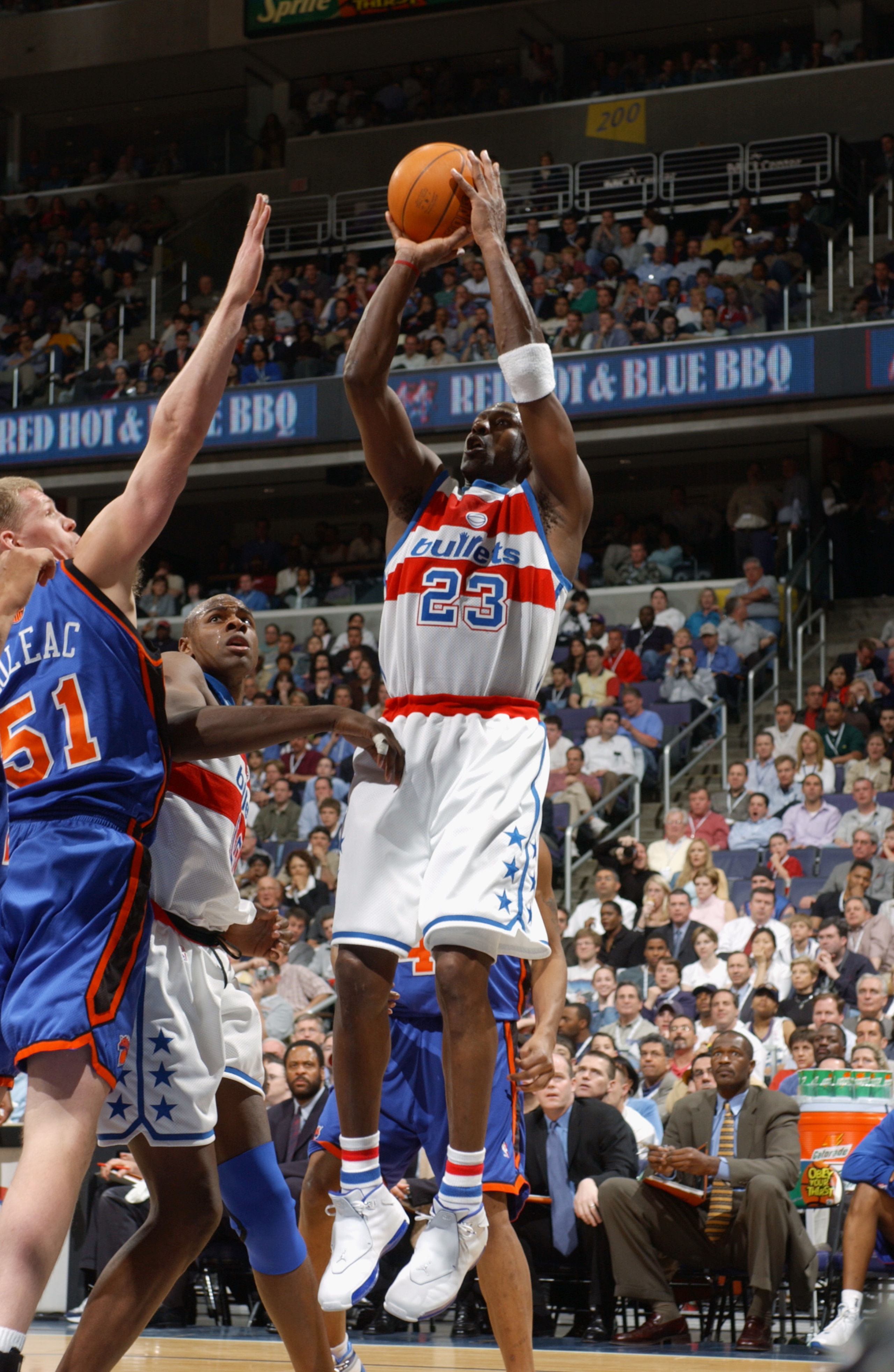 WASHINGTON - APRIL 14:  Michael Jordan #23 of the Washington Wizards shoots a jump shot over Michael Doleac #51 of the New York Knicks during Jordan's final home game at MCI Center on April 14, 2003 in Washington, DC.  The Knicks won 93-79.  NOTE TO USER: