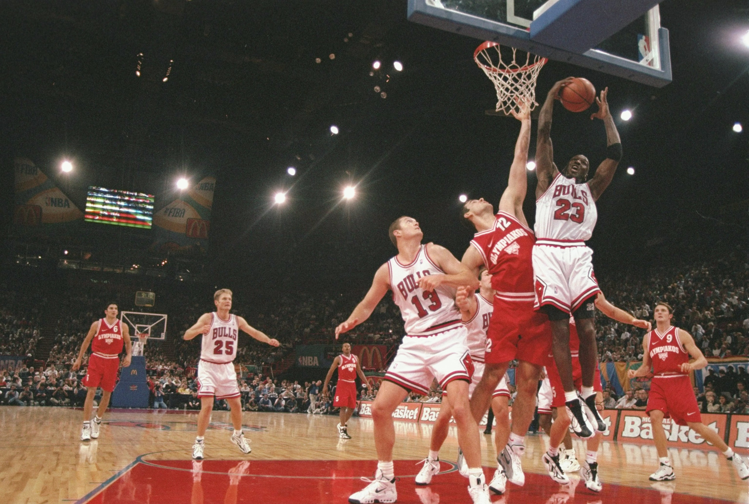 18 Oct 1997:  Guard Michael Jordan #23 of the Chicago Bulls grabs the rebound during an exhibition game between the Chicago Bulls and the Olympiakos during the McDonald''s Championship at the Palais  Omnisports De Paris-Bercy in Paris, France.  The Bulls