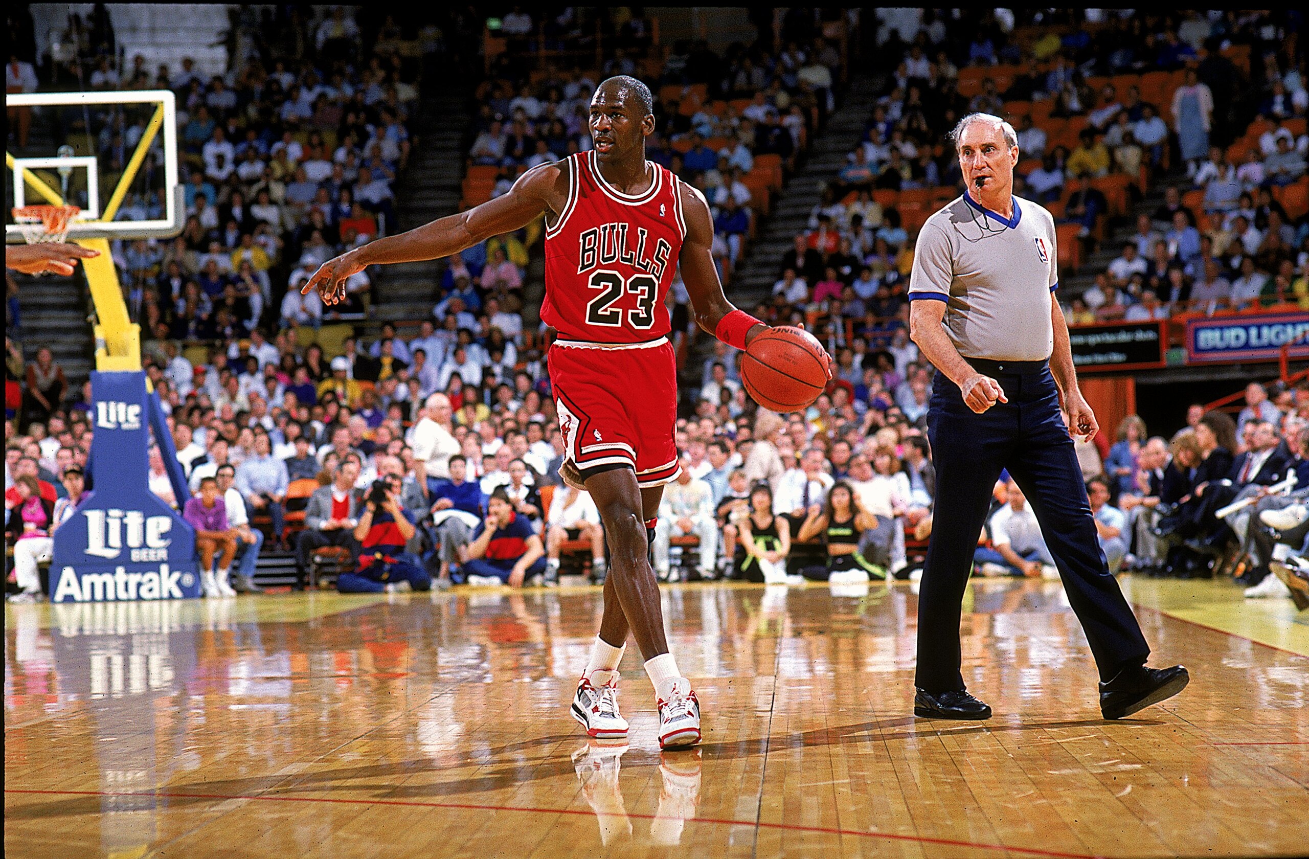 1989:  Michael Jordan #23 of the Chicago Bulls points and walks with the ball during the game.   Mandatory Credit: Tim DeFrisco  /Allsport