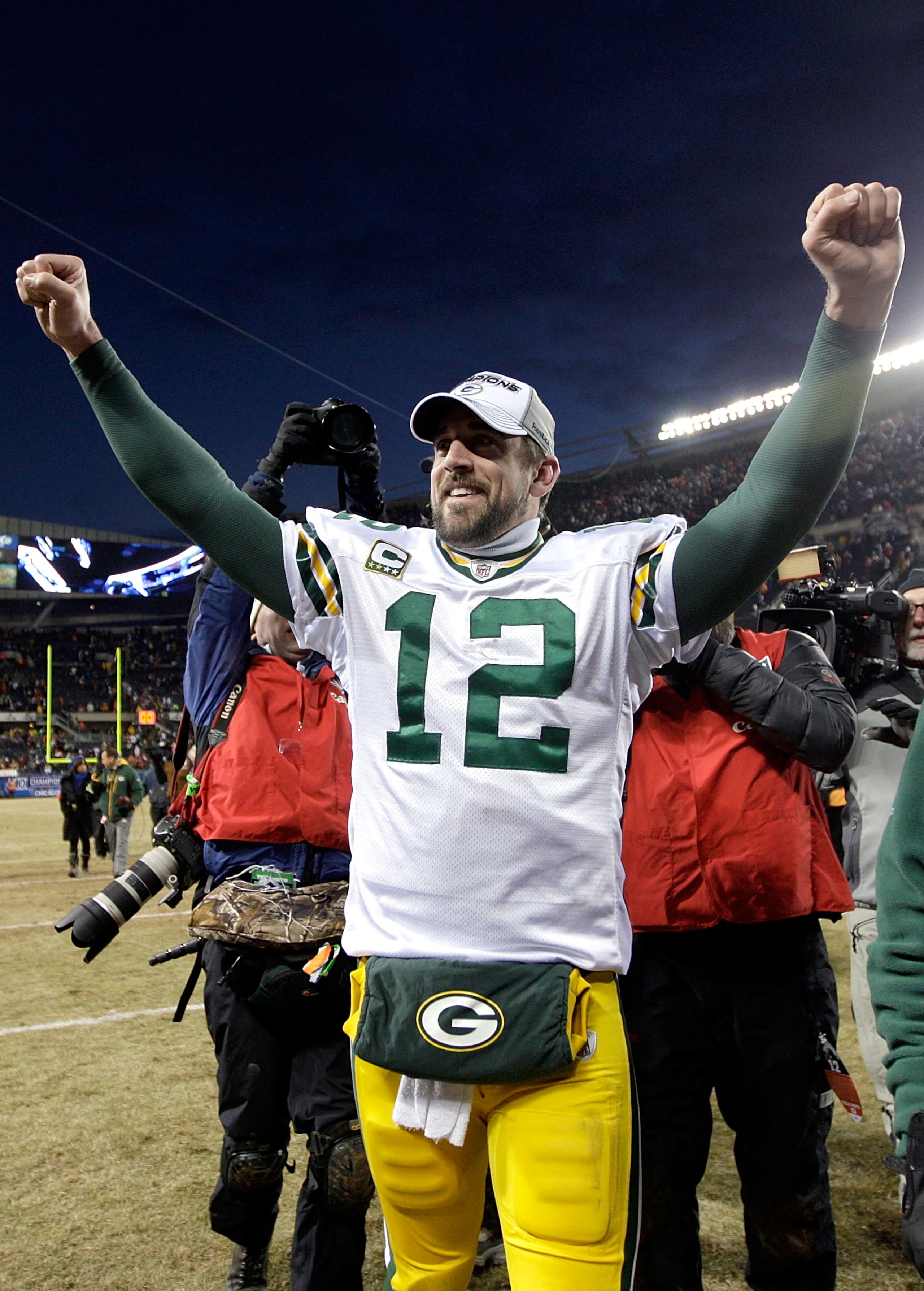 CHICAGO, IL - JANUARY 23: Quarterback Aaron Rodgers #12 of the Green Bay Packers celebrates the Packers 21-14 victory against the Chicago Bears in the NFC Championship Game at Soldier Field on January 23, 2011 in Chicago, Illinois. (Photo by Jamie Squir CHICAGO, IL - JANUARY 23: Quarterback Aaron Rodgers #12 of the Green Bay Packers celebrates the Packers 21-14 victory against the Chicago Bears in the NFC Championship Game at Soldier Field on January 23, 2011 in Chicago, Illinois. (Photo by Jamie Squir
