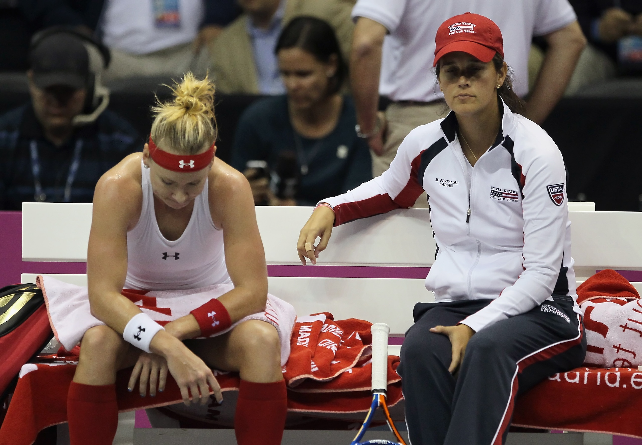 SAN DIEGO - NOVEMBER 06:  Bethanie Mattek-Sands (L) and captain Mary Joe Fernandez look on between a game against Flavia Pennetta of Italy during their Fed Cup final singles match at the San Diego Sports Arena on November 6, 2010 in San Diego, California.