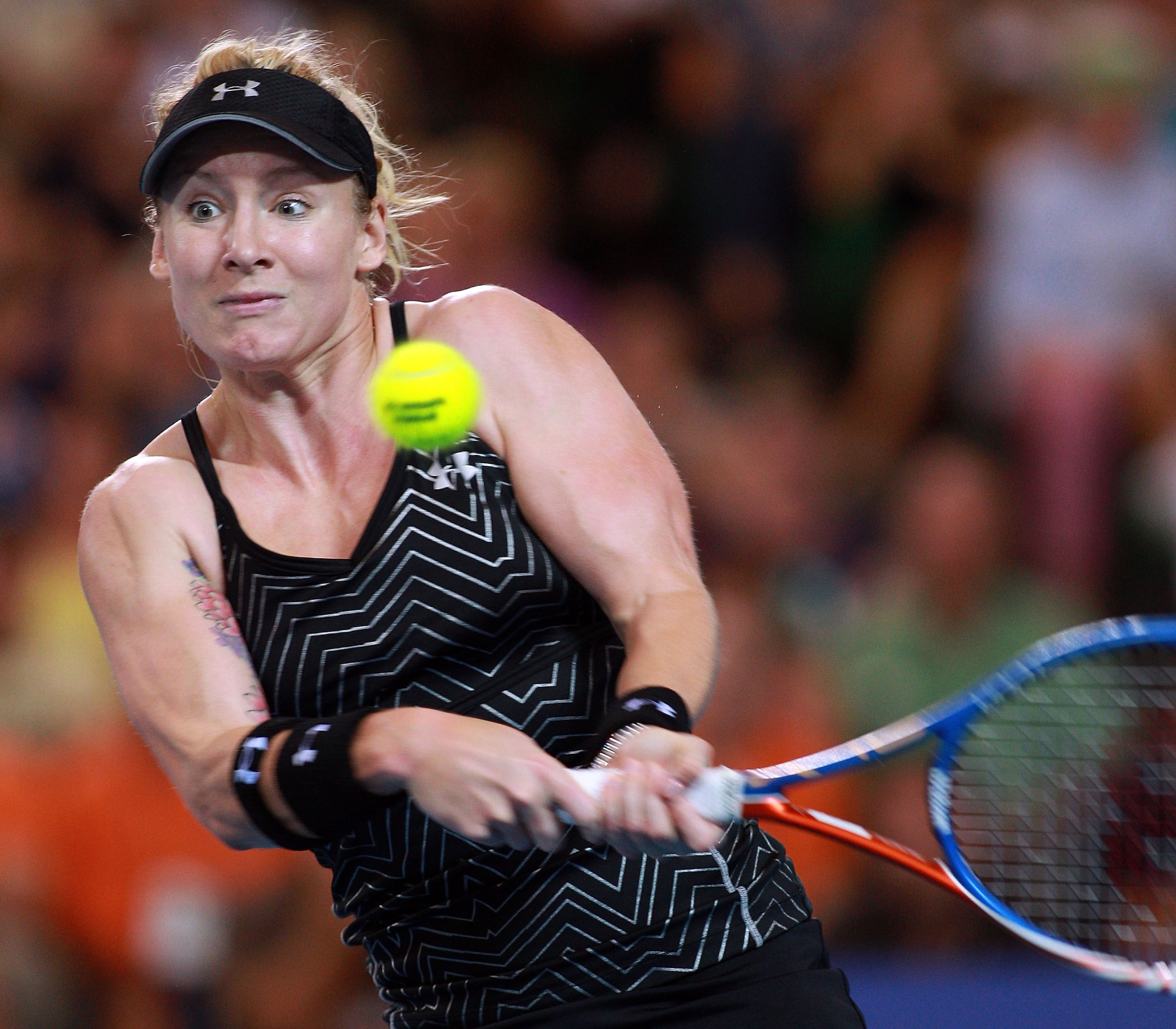 PERTH, AUSTRALIA - JANUARY 08:  Bethanie Mattek-Sands of the USA plays a return shot during her singles match against Justine Henin of Belgium on day eight of the Hopman Cup on January 8, 2011 in Perth, Australia.  (Photo by Paul Kane/Getty Images)