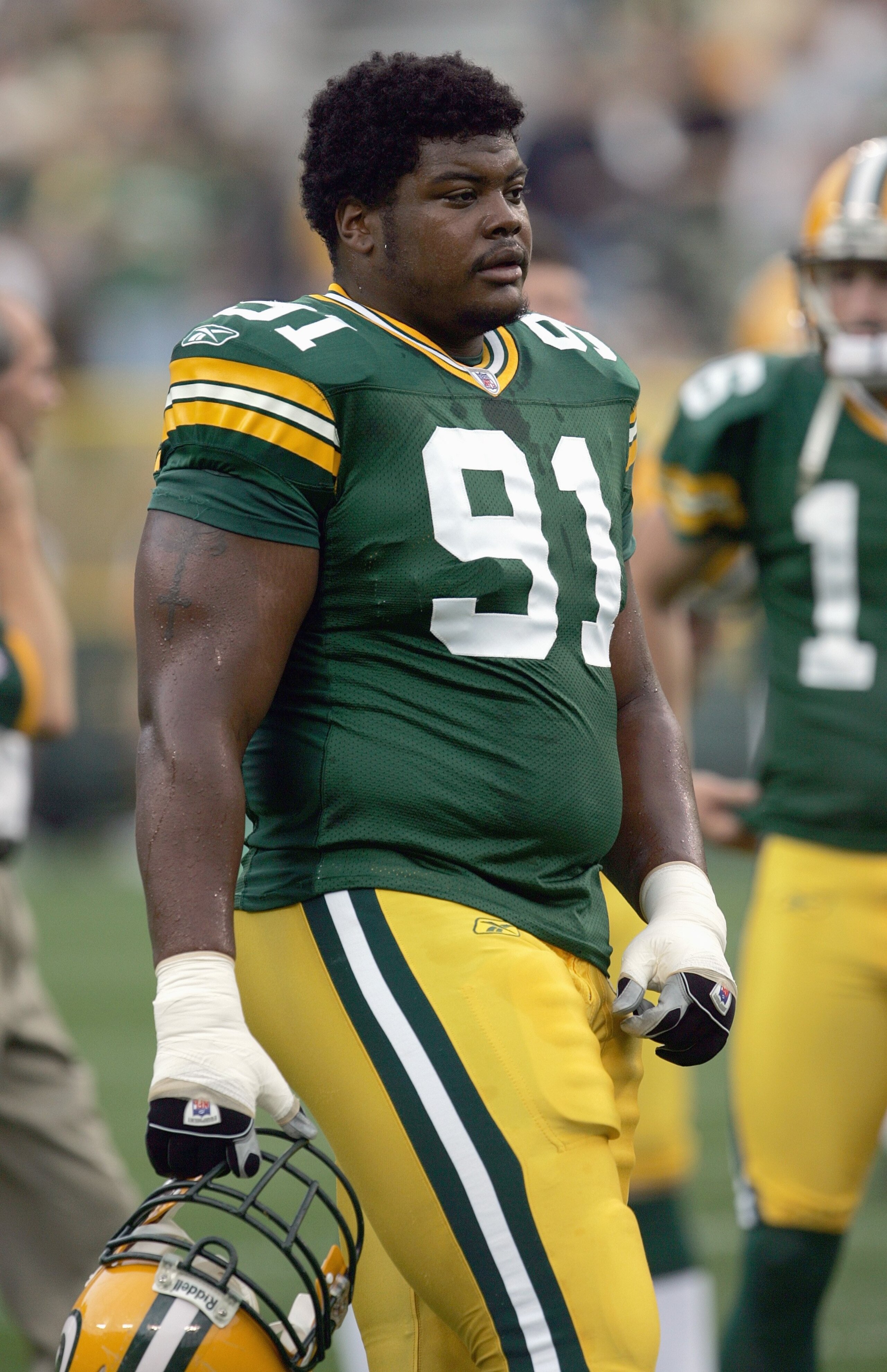 GREEN BAY, WI - AUGUST 23:  Justin Harrell #91 of the Green Bay Packers moves on the field before the game against the Jacksonville Jaguars on August 23, 2007 at Lambeau Field in Green Bay, Wisconsin. (Photo by Jonathan Daniel/Getty Images)