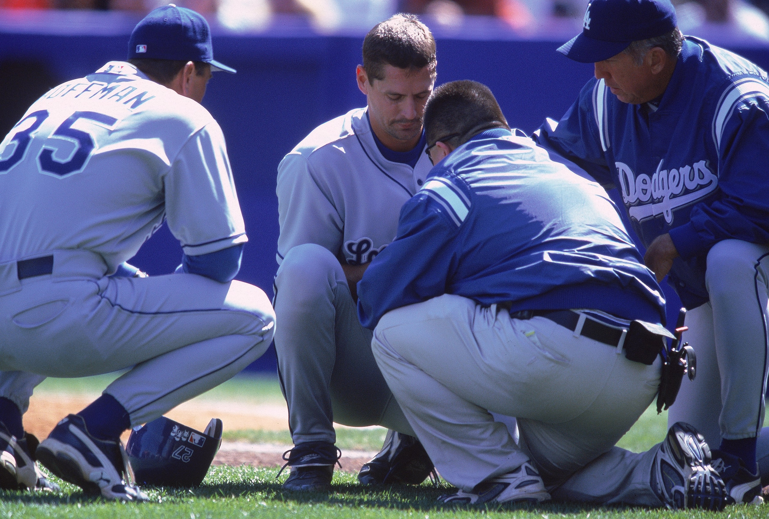 8 Apr 2000: Kevin Brown #27 of the Los Angeles Dodgers shows his injured finger to Glenn Hoffman #35 and Davey Johnson during the game against the New York Mets at Shea Stadium in Flushing, New York. The Dodgers defeated the Mets 6-5. Mandatory Credit: Ez