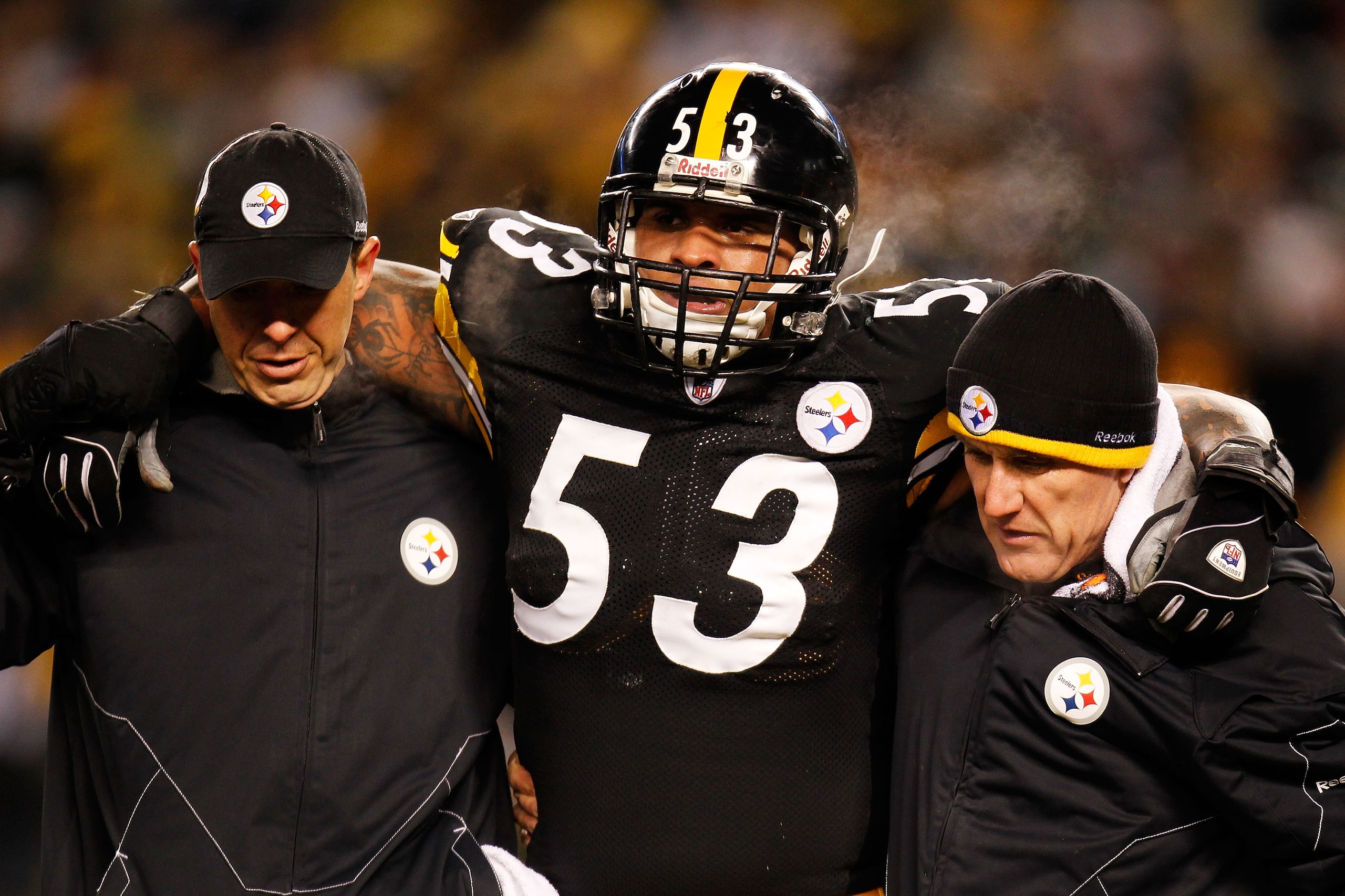 PITTSBURGH, PA - JANUARY 23:  Maurkice Pouncey #53 of the Pittsburgh Steelers is helped off of the field after being injured in the first quarter against the New York Jets during the 2011 AFC Championship game at Heinz Field on January 23, 2011 in Pittsbu
