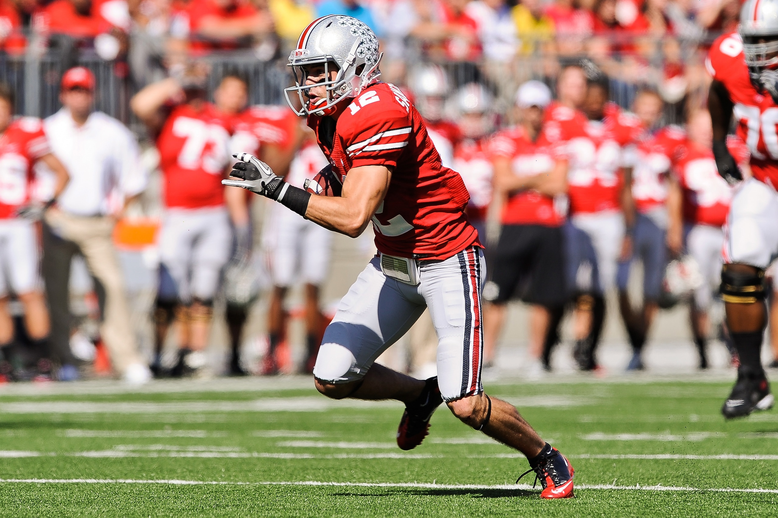 COLUMBUS, OH - OCTOBER 9: Dane Sanzenbacher #12 of the Ohio State Buckeyes runs with the ball against the Indiana Hoosiers at Ohio Stadium on October 9, 2010 in Columbus, Ohio. (Photo by Jamie Sabau/Getty Images) COLUMBUS, OH - OCTOBER 9: Dane Sanzenbacher #12 of the Ohio State Buckeyes runs with the ball against the Indiana Hoosiers at Ohio Stadium on October 9, 2010 in Columbus, Ohio. (Photo by Jamie Sabau/Getty Images)