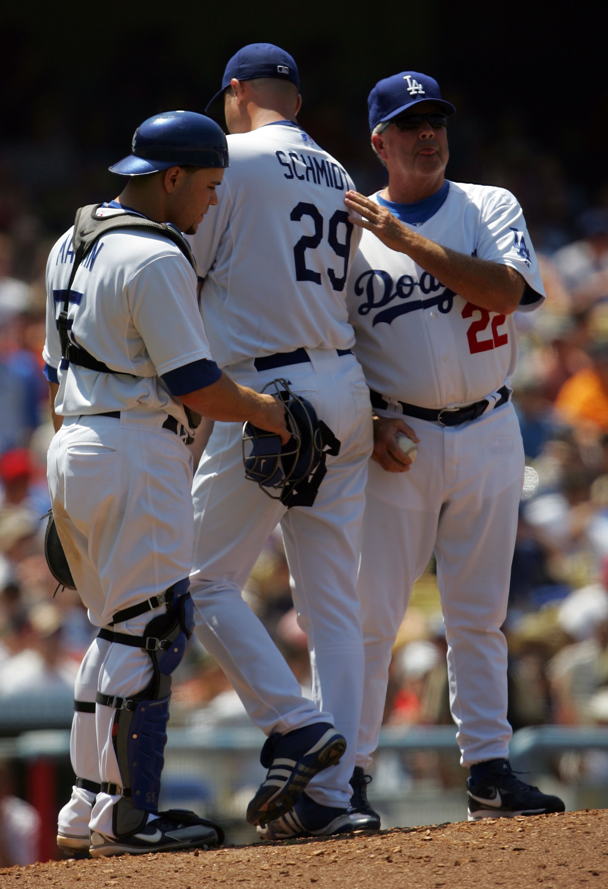 LOS ANGELES, CA - JUNE 16:  Starting pitcher Jason Schmidt #29 of the Los Angeles Dodgers is pulled from the game in the fifth inning by manager Grady Little (R) as catcher Russell Martin (L) looks on against the Los Angeles Angels of Anaheim during an in