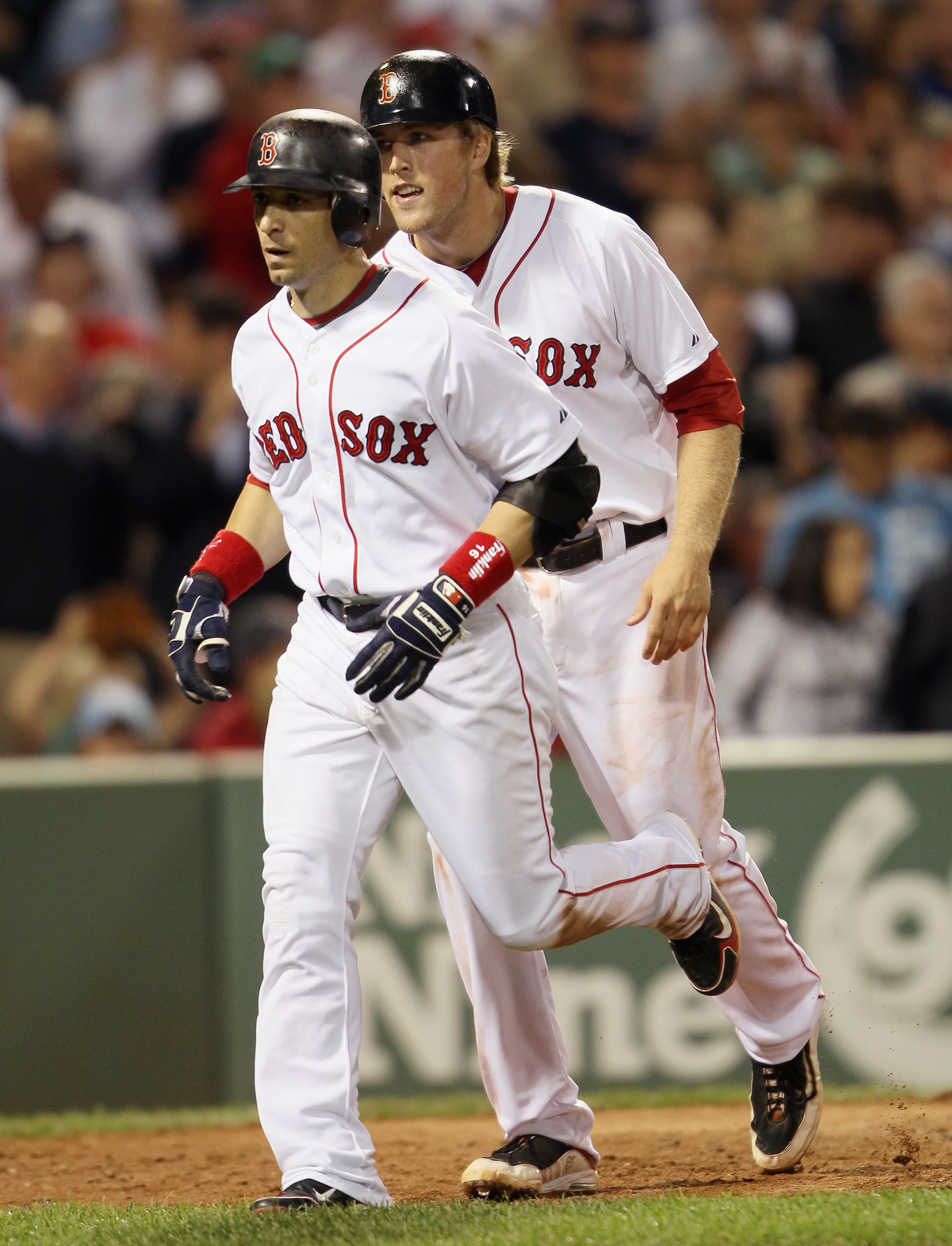 BOSTON - SEPTEMBER 08: Lars Anderson #44 and Marco Scutaro #16 of the Boston Red Sox head for the dugout after both scored on Scutaro's home run against the Tampa Bay Rays on September 8, 2010 at Fenway Park in Boston, Massachusetts. (Photo by Elsa/Gett BOSTON - SEPTEMBER 08: Lars Anderson #44 and Marco Scutaro #16 of the Boston Red Sox head for the dugout after both scored on Scutaro's home run against the Tampa Bay Rays on September 8, 2010 at Fenway Park in Boston, Massachusetts. (Photo by Elsa/Gett