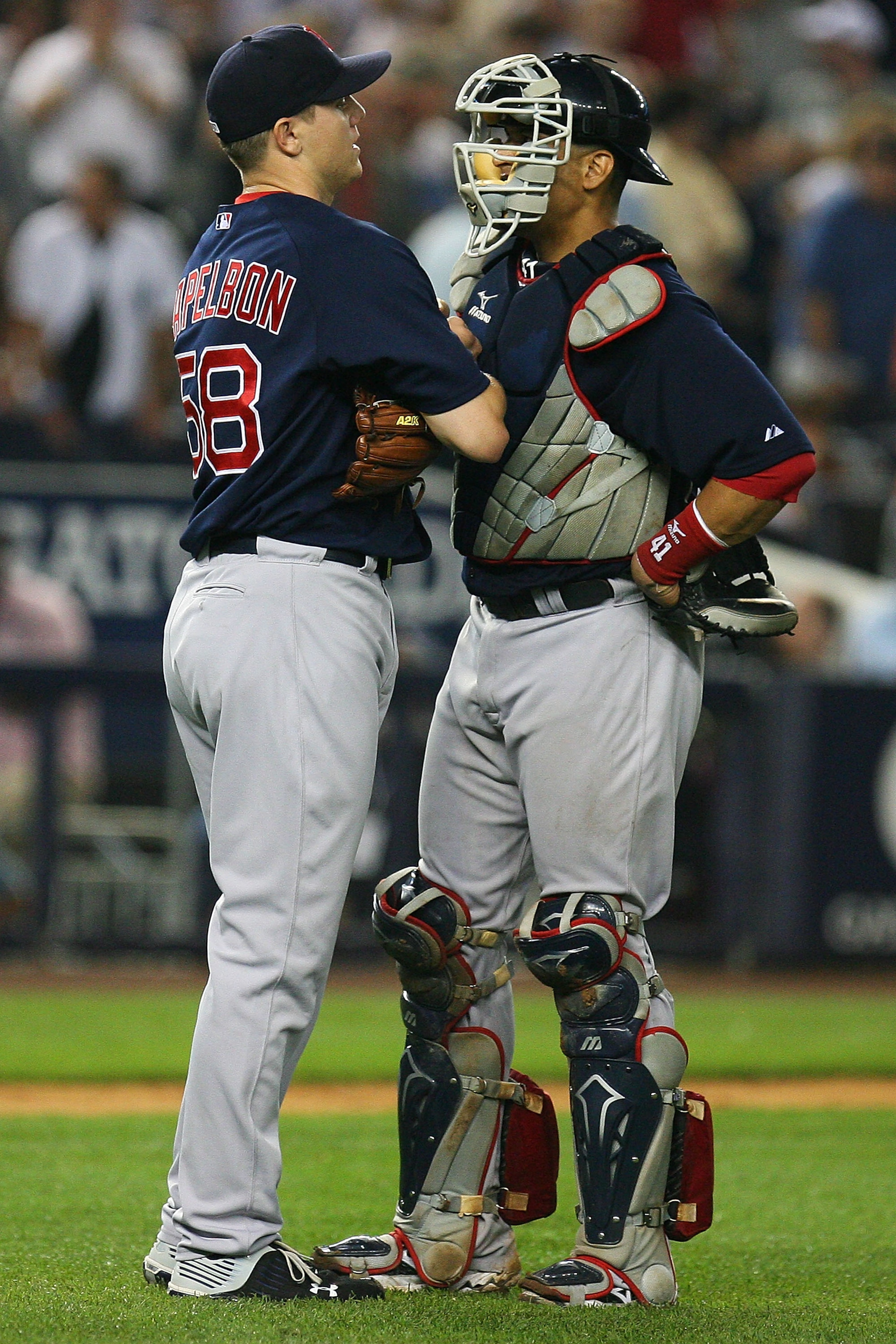 NEW YORK - SEPTEMBER 24: Jonathan Papelbon #58 of the Boston Red Sox meets with Victor Martinez #41 during the ninth inning against the New York Yankees on September 24, 2010 at Yankee Stadium in the Bronx borough of New York City. The Red Sox defeated t NEW YORK - SEPTEMBER 24: Jonathan Papelbon #58 of the Boston Red Sox meets with Victor Martinez #41 during the ninth inning against the New York Yankees on September 24, 2010 at Yankee Stadium in the Bronx borough of New York City. The Red Sox defeated t