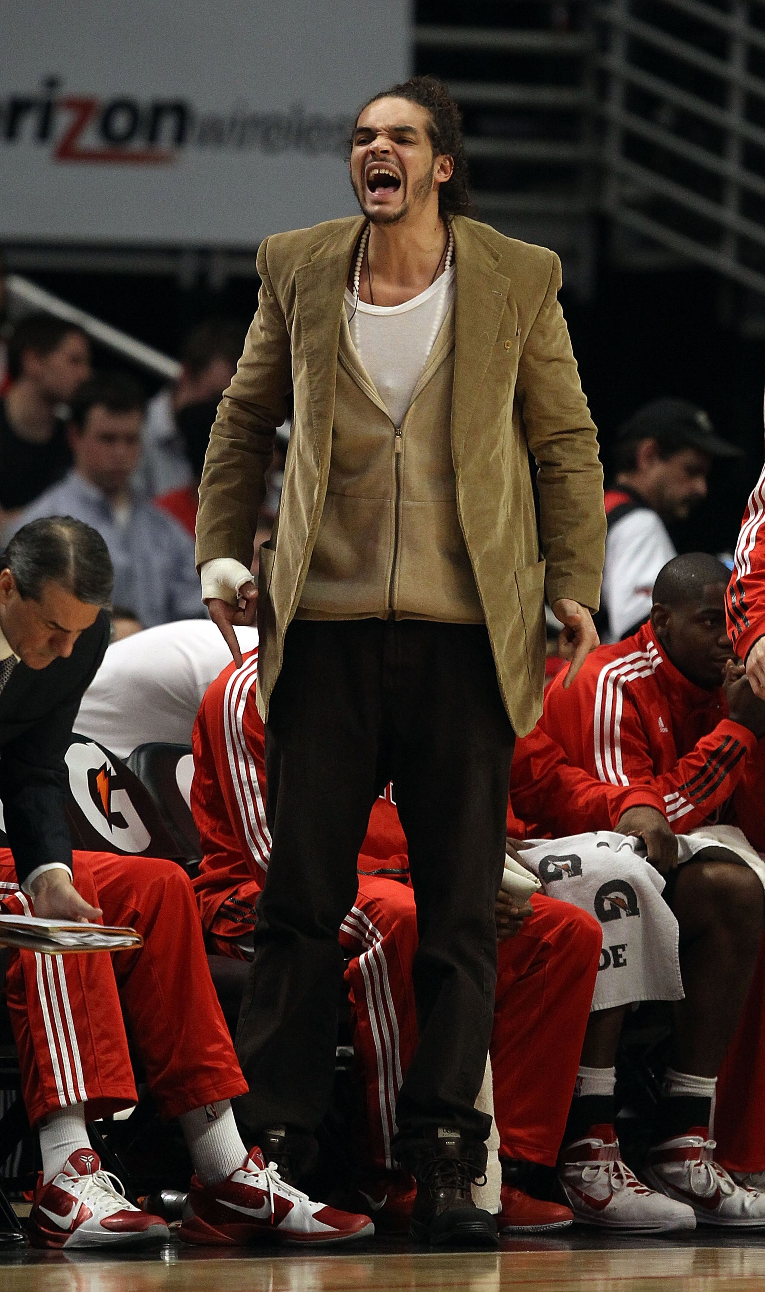 CHICAGO, IL - JANUARY 28: Injured player Joakim Noah of the Chicago Bulls shouts encouragement to teammates from the bench during a game against the Orlando Magic at the United Center on January 28, 2011 in Chicago, Illinois. The Bulls defeated the Magic