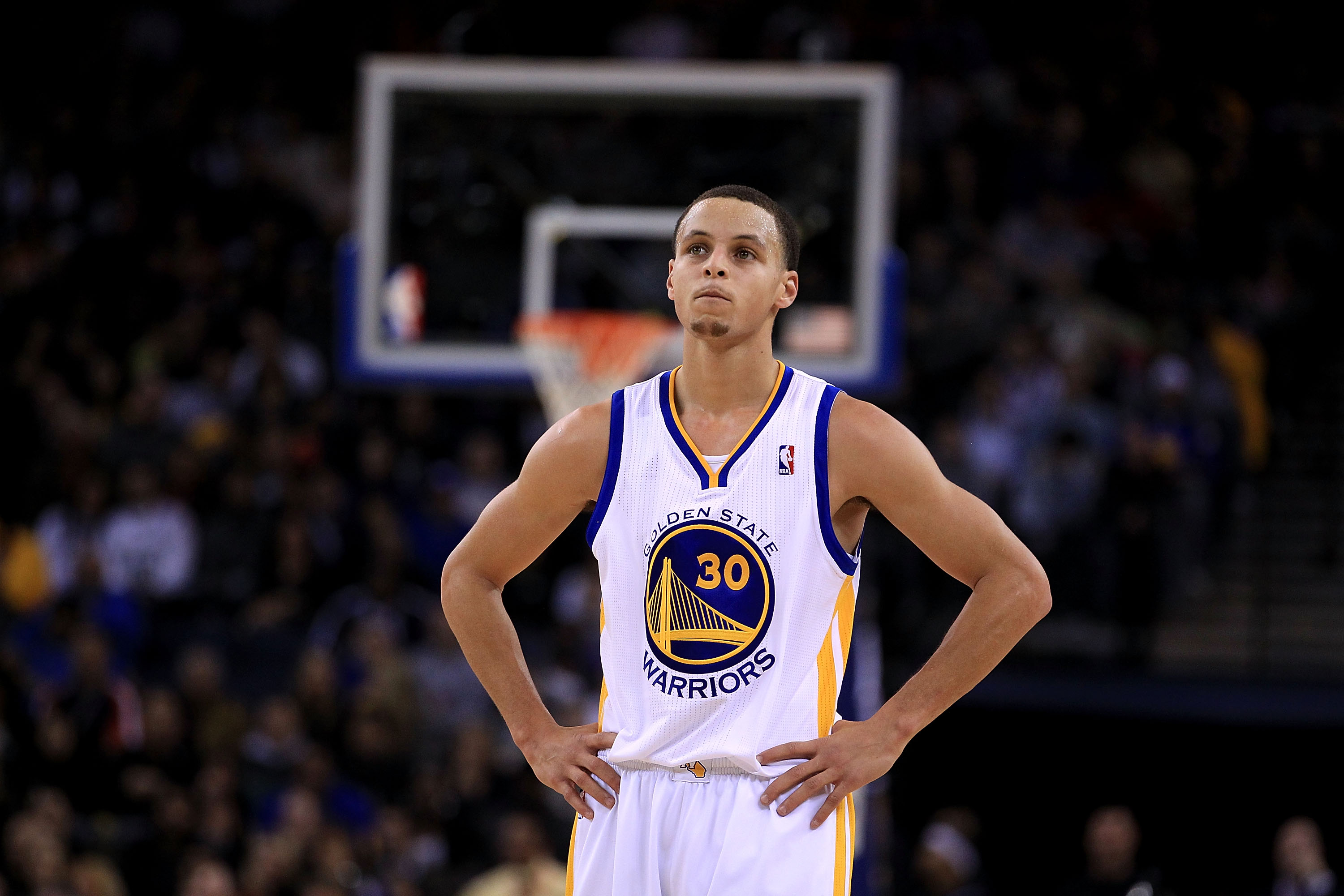 OAKLAND, CA - JANUARY 24:  Stephen Curry #30 of the Golden State Warriors stands at midcourt during their game against the San Antonio Spurs at Oracle Arena on January 24, 2011 in Oakland, California.  NOTE TO USER: User expressly acknowledges and agrees
