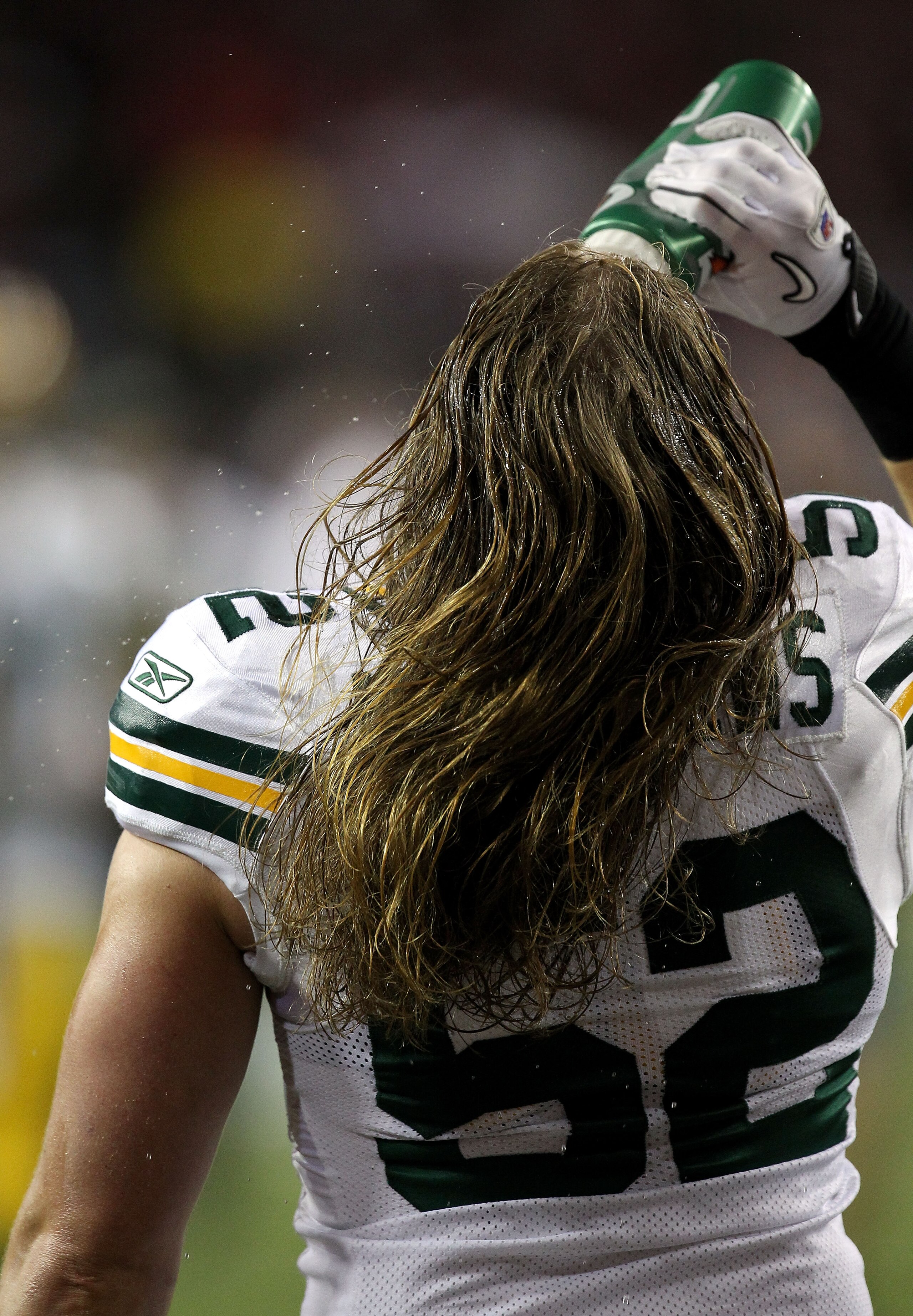 ATLANTA, GA - JANUARY 15:  Clay Matthews #52 of the Green Bay Packers squirts water on his face durign wamr ups against the Atlanta Falcons during their 2011 NFC divisional playoff game at Georgia Dome on January 15, 2011 in Atlanta, Georgia.  (Photo by S