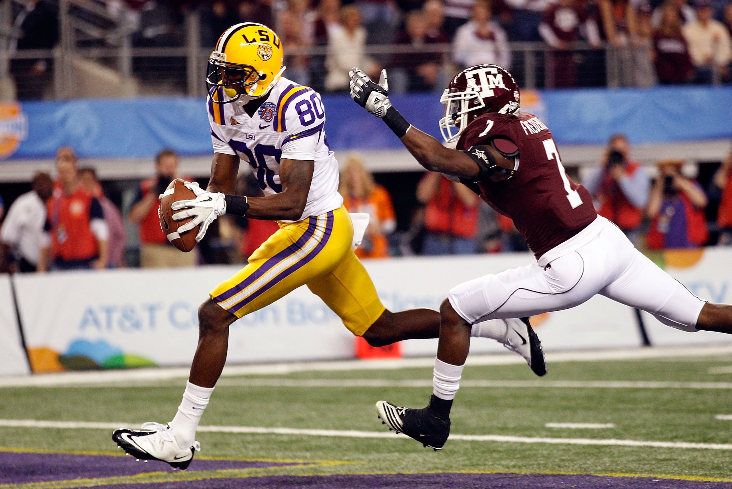 ARLINGTON, TX - JANUARY 07:  Terrence Toliver #80 of the Louisiana State University Tigers catches a touchdown pass over Terrence McCoy #7 of the Texas A&M Aggies during the AT&T Cotton Bowl at Cowboys Stadium on January 7, 2011 in Arlington, Texas.  (Pho