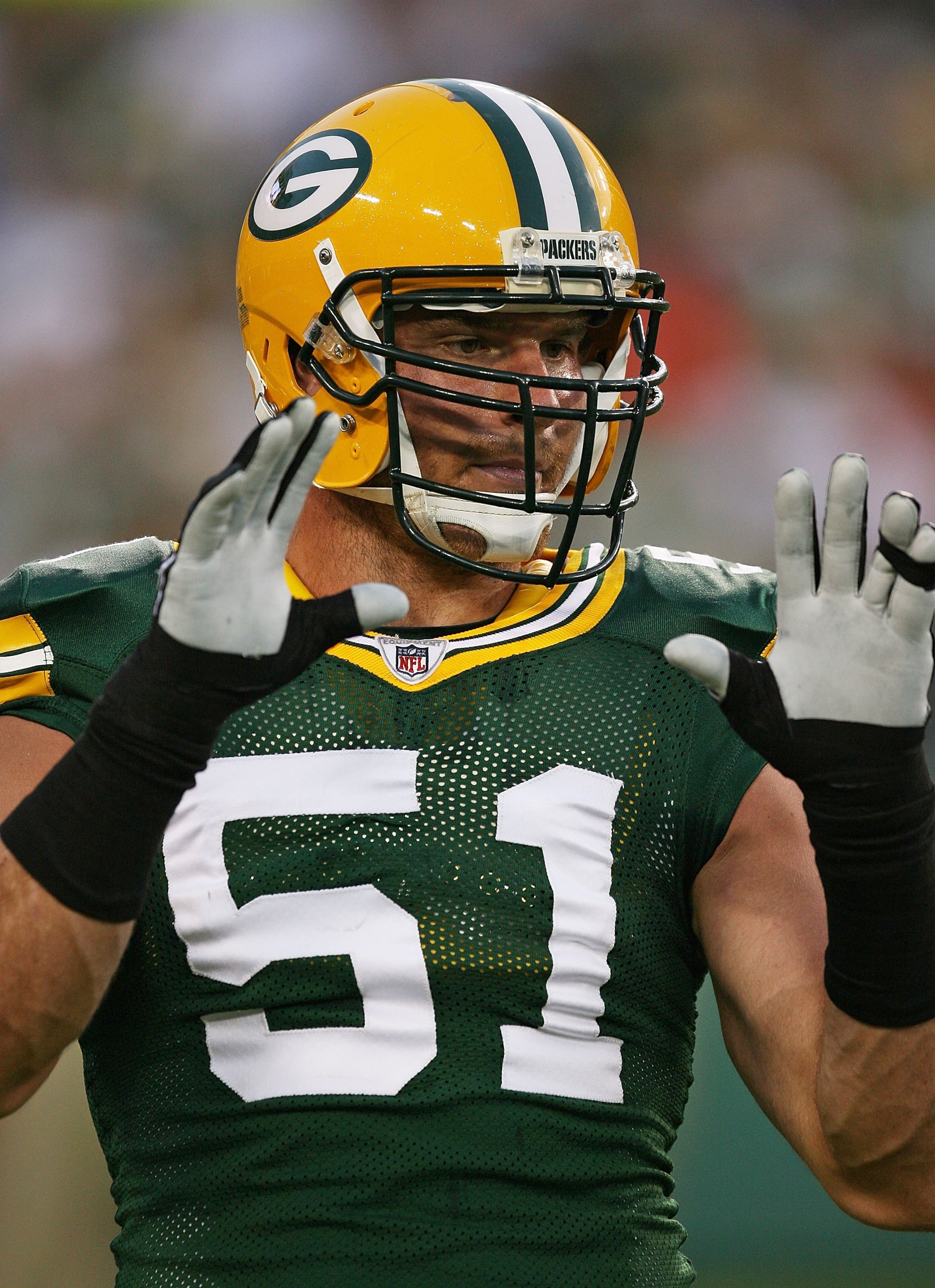 GREEN BAY, WI - SEPTEMBER 13: Brady Poppinga #51 of the Green Bay Packers participates in warm-ups before a game against the Chicago Bears on September 13, 2009 at Lambeau Field in Green Bay, Wisconsin. The Packers defeated the Bears 21-15.  (Photo by Jon