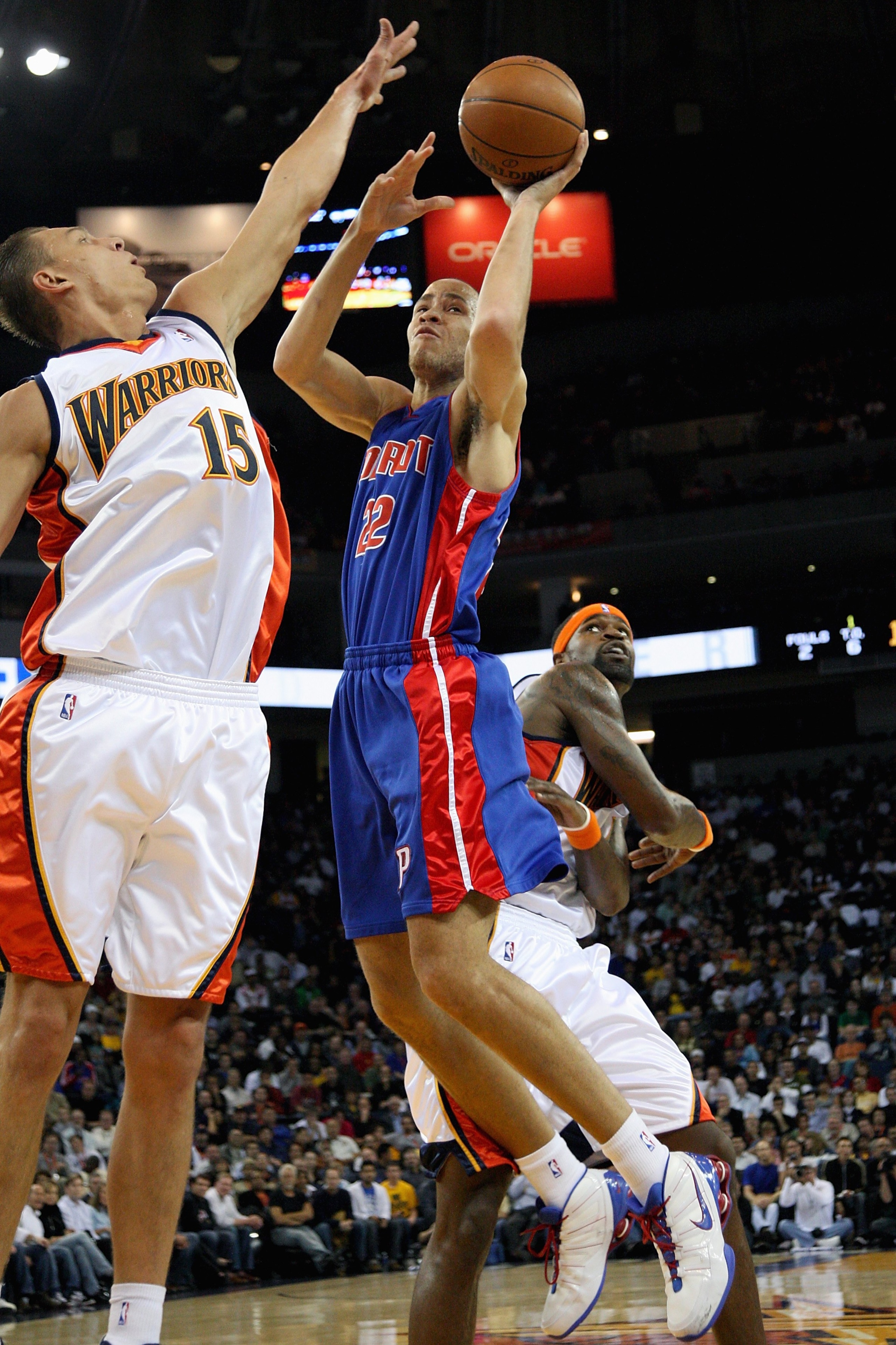 OAKLAND, CA - NOVEMBER 13:  Tayshaun Prince #22 of the Detroit Pistons goes up for a shot over Andris Biedrins #15 and Stephen Jackson #1 of the Golden State Warriors during the game on November 13, 2008 at Oracle Arena in Oakland, California.  The Piston