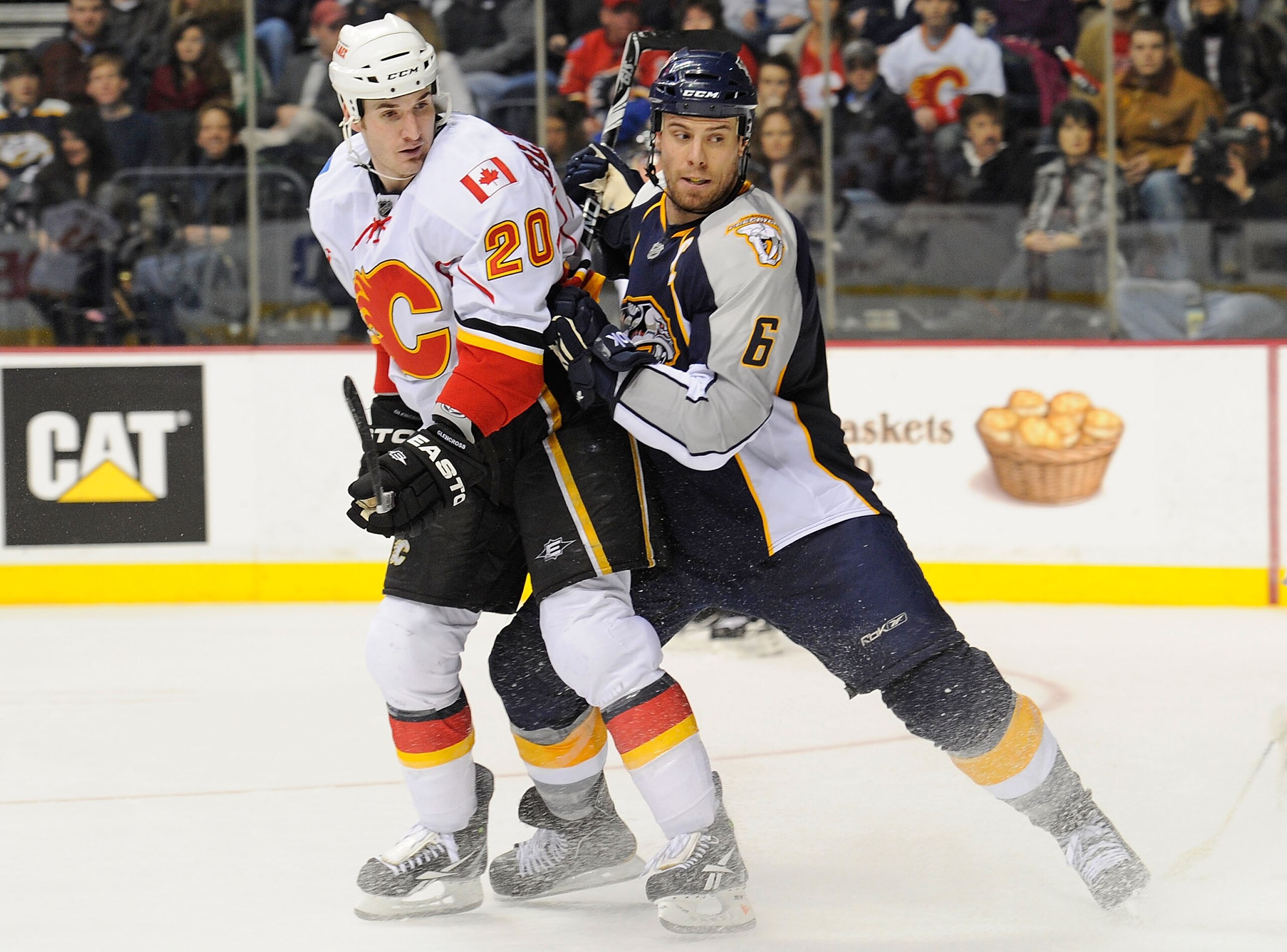 NASHVILLE, TN - FEBRUARY 01:  Shea Weber #6 of the Nashville Predators checks Curtis Glencross #20 of the Calgary Flames on February 1, 2011 at the Bridgestone Arena in Nashville, Tennessee.  (Photo by Frederick Breedon/Getty Images)