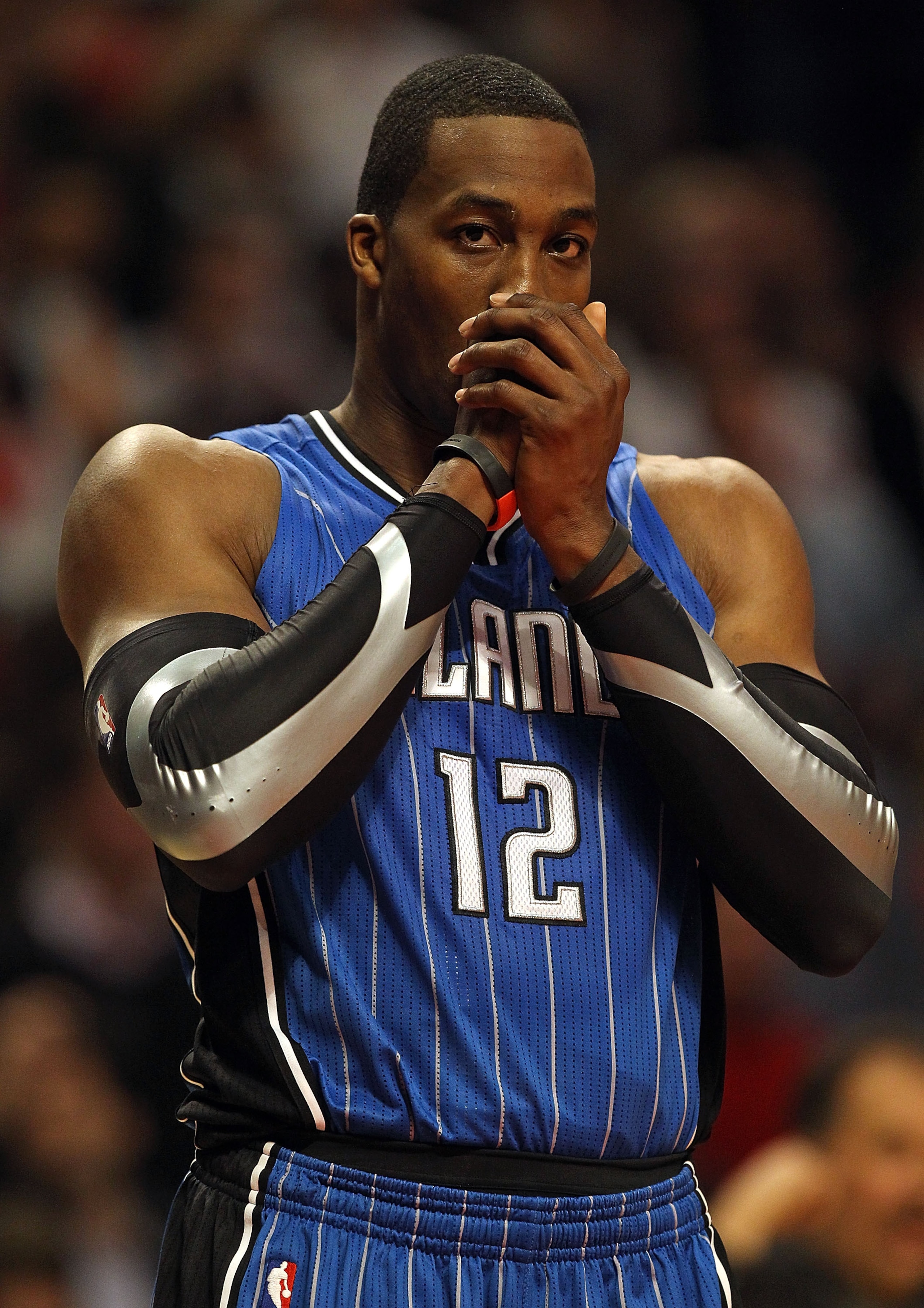 CHICAGO, IL - JANUARY 28: Dwight Howard #12 of the Orlando Magic warms his hands on the line during a game against the Chicago Bulls at the United Center on January 28, 2011 in Chicago, Illinois. The Bulls defeated the Magic 99-90. NOTE TO USER: User expr