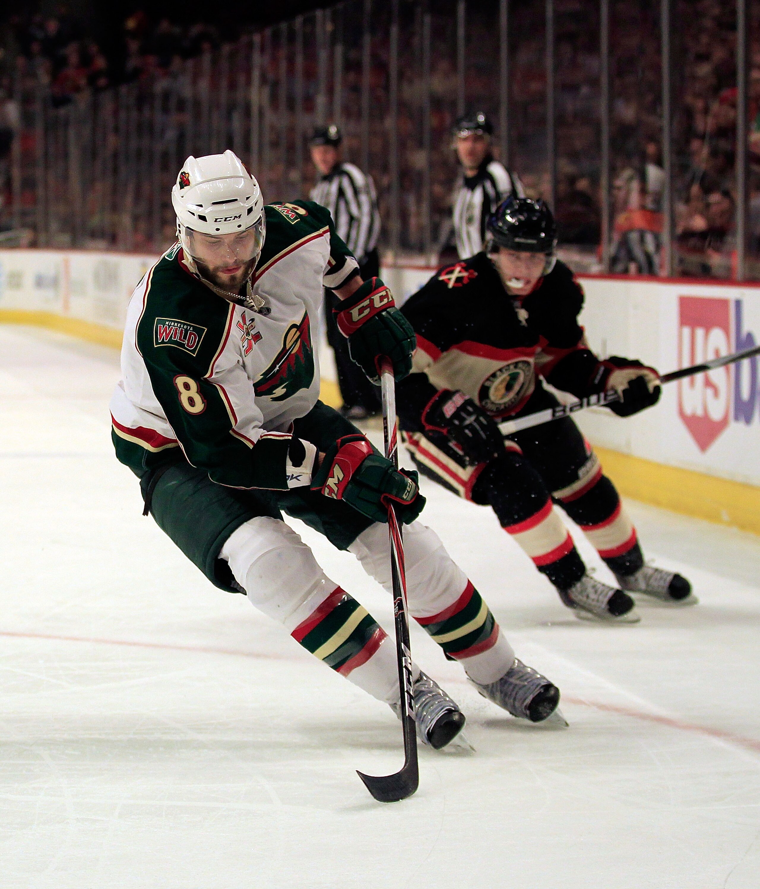 CHICAGO, IL - JANUARY 25: Brent Burns #8 of the Minnesota Wild controls the puck against Patrick Kane #88 of the Chicago Blackhawks at the United Center on January 25, 2011 in Chicago, Illinois. The Wild defeated the Blackhawks 4-2. (Photo by Jonathan Dan