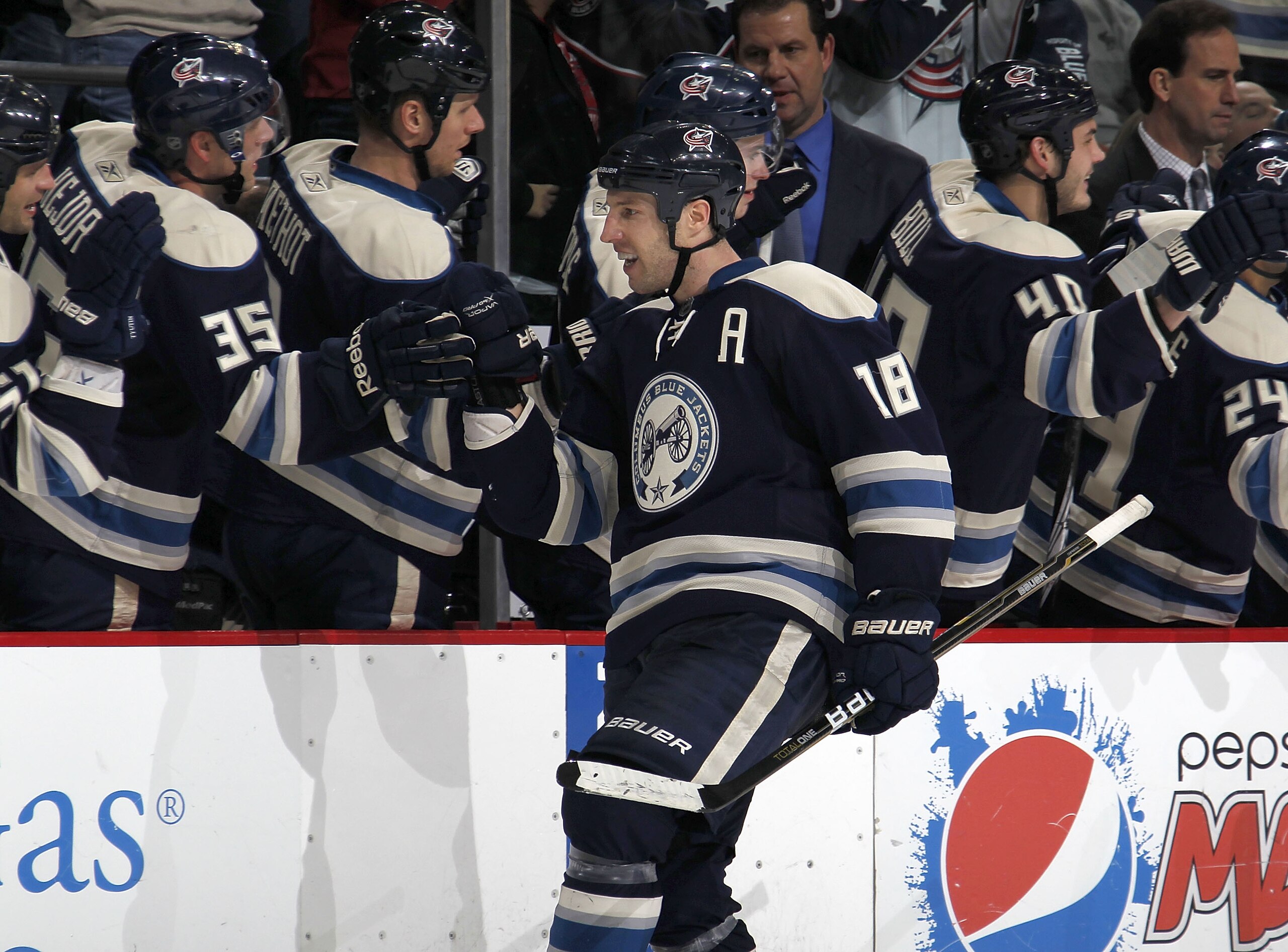 COLUMBUS, OH - FEBRUARY 05:  RJ Umberger #18 of the Columbus Blue Jackets celebrates his third period goal with teammates while playing the Edmonton Oilers at Nationwide Arena on February 5, 2011 in Columbus, Ohio. Columbus won the game 4-3.  (Photo by Gr