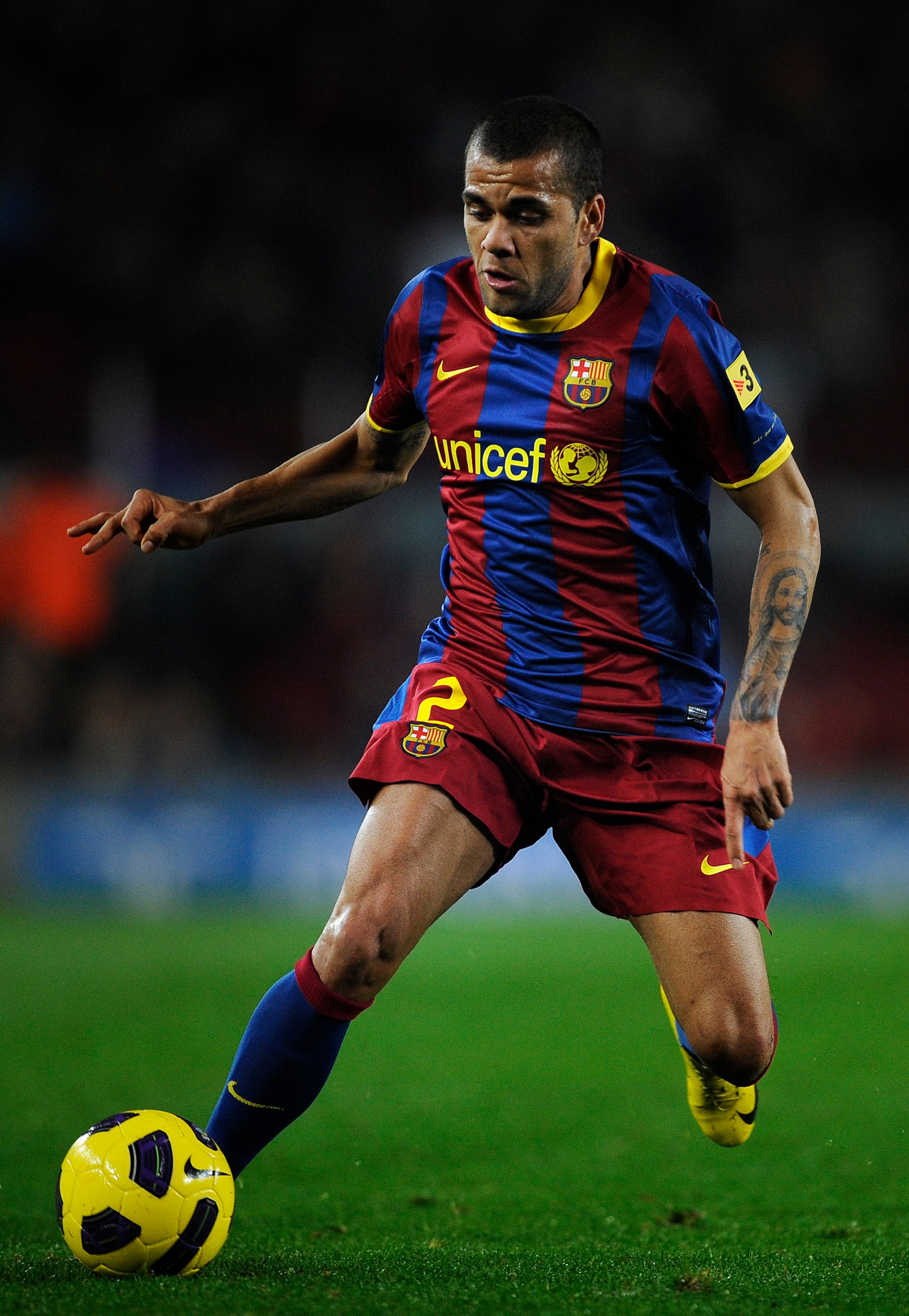 BARCELONA, SPAIN - JANUARY 12:  Dani Alves  of FC Barcelona runs with the ball during the Copa del Rey quarter final first leg match between FC Barcelona and Betis at Camp Nou on January 12, 2011 in Barcelona, Spain. Barcelona won 5-0.  (Photo by David Ra