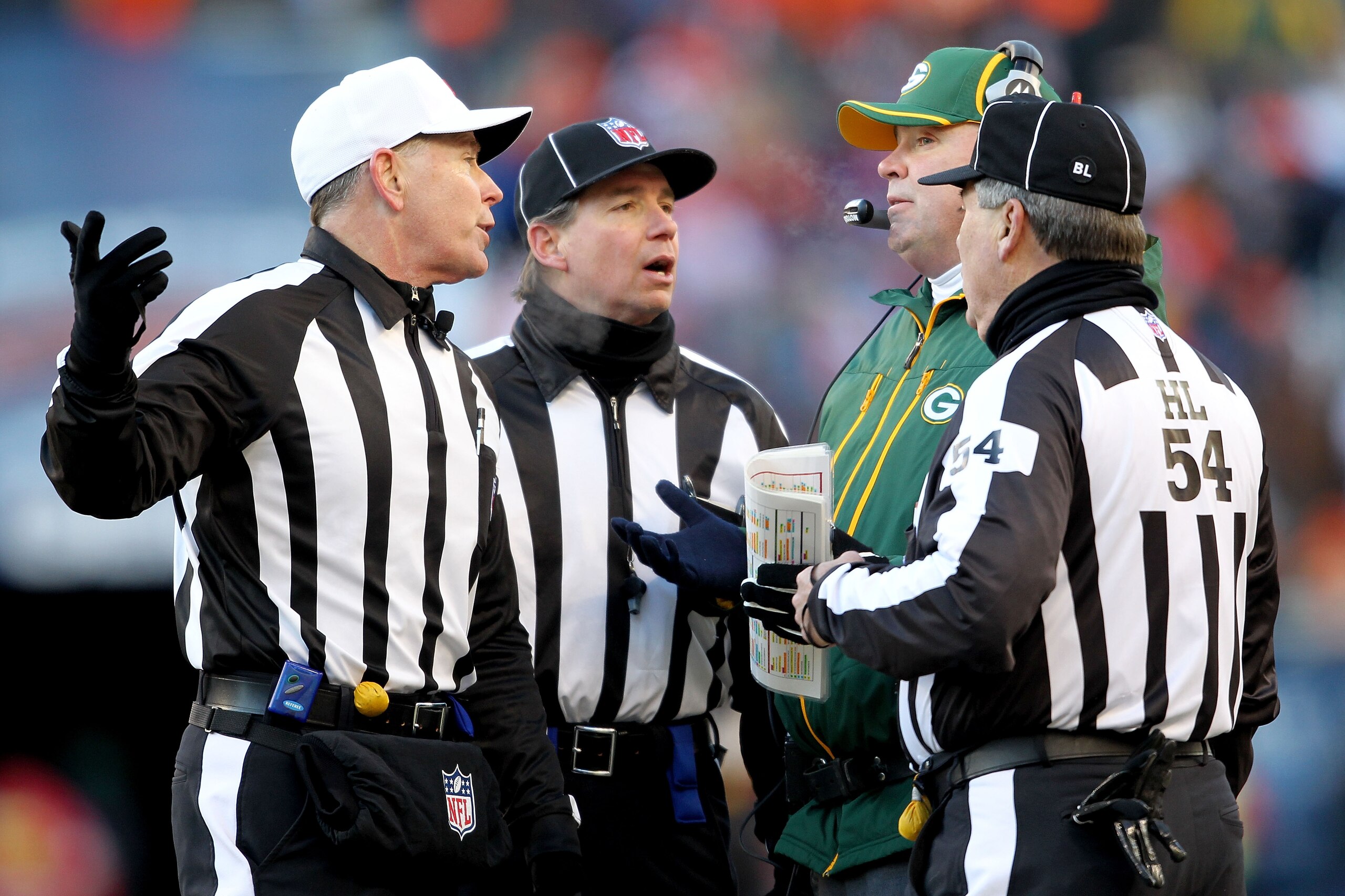 CHICAGO, IL - JANUARY 23:  Head coach Mike McCarthy of the Green Bay Packers talks with referee Terry McAulay #77 in the second quarter against the Chicago Bears in the NFC Championship Game at Soldier Field on January 23, 2011 in Chicago, Illinois.  (Pho