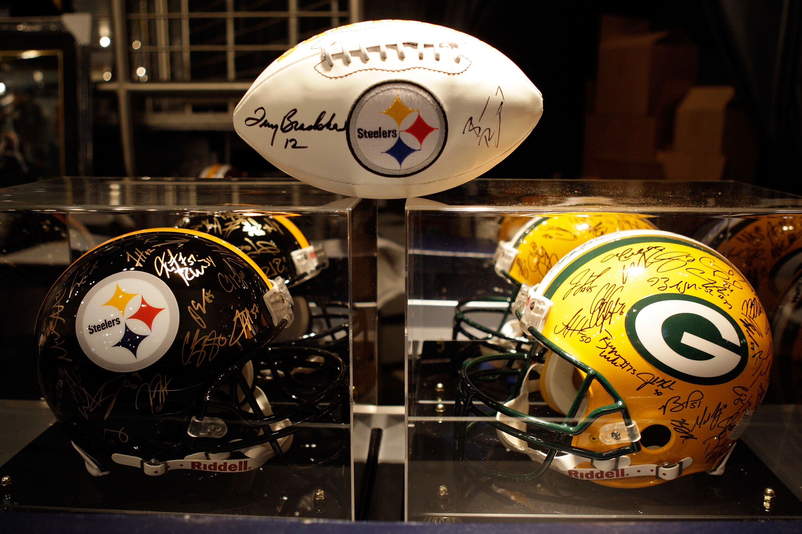 ARLINGTON, TX - FEBRUARY 06:  Signed Pittsburgh Steelers and Green Bay Packers helmets and footballs are displayed inside the Pro Shop at Cowboys Stadium before Super Bowl XLV on February 6, 2011 in Arlington, Texas.  (Photo by Jamie Squire/Getty Images)