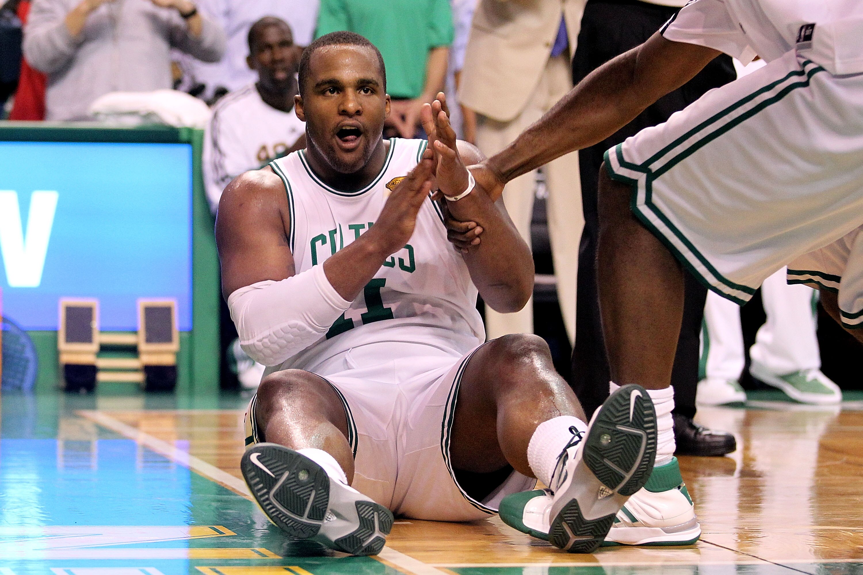 BOSTON - JUNE 10:  Glen Davis #11 of the Boston Celtics is helped up from the court during Game Four of the 2010 NBA Finals against the Los Angeles Lakers on June 10, 2010 at TD Garden in Boston, Massachusetts. NOTE TO USER: User expressly acknowledges an