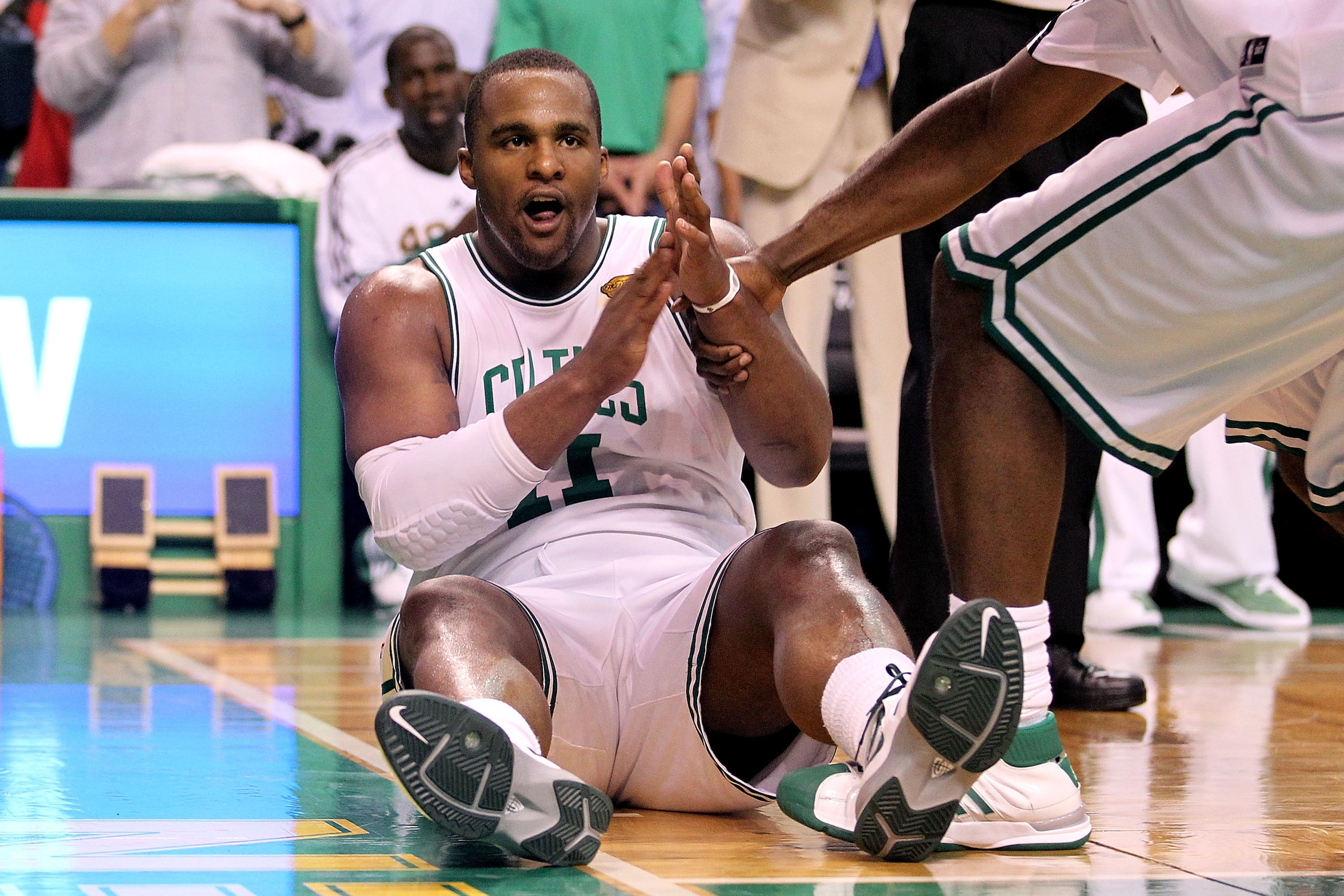 BOSTON - JUNE 10: Glen Davis #11 of the Boston Celtics is helped up from the court during Game Four of the 2010 NBA Finals against the Los Angeles Lakers on June 10, 2010 at TD Garden in Boston, Massachusetts. NOTE TO USER: User expressly acknowledges an BOSTON - JUNE 10: Glen Davis #11 of the Boston Celtics is helped up from the court during Game Four of the 2010 NBA Finals against the Los Angeles Lakers on June 10, 2010 at TD Garden in Boston, Massachusetts. NOTE TO USER: User expressly acknowledges an