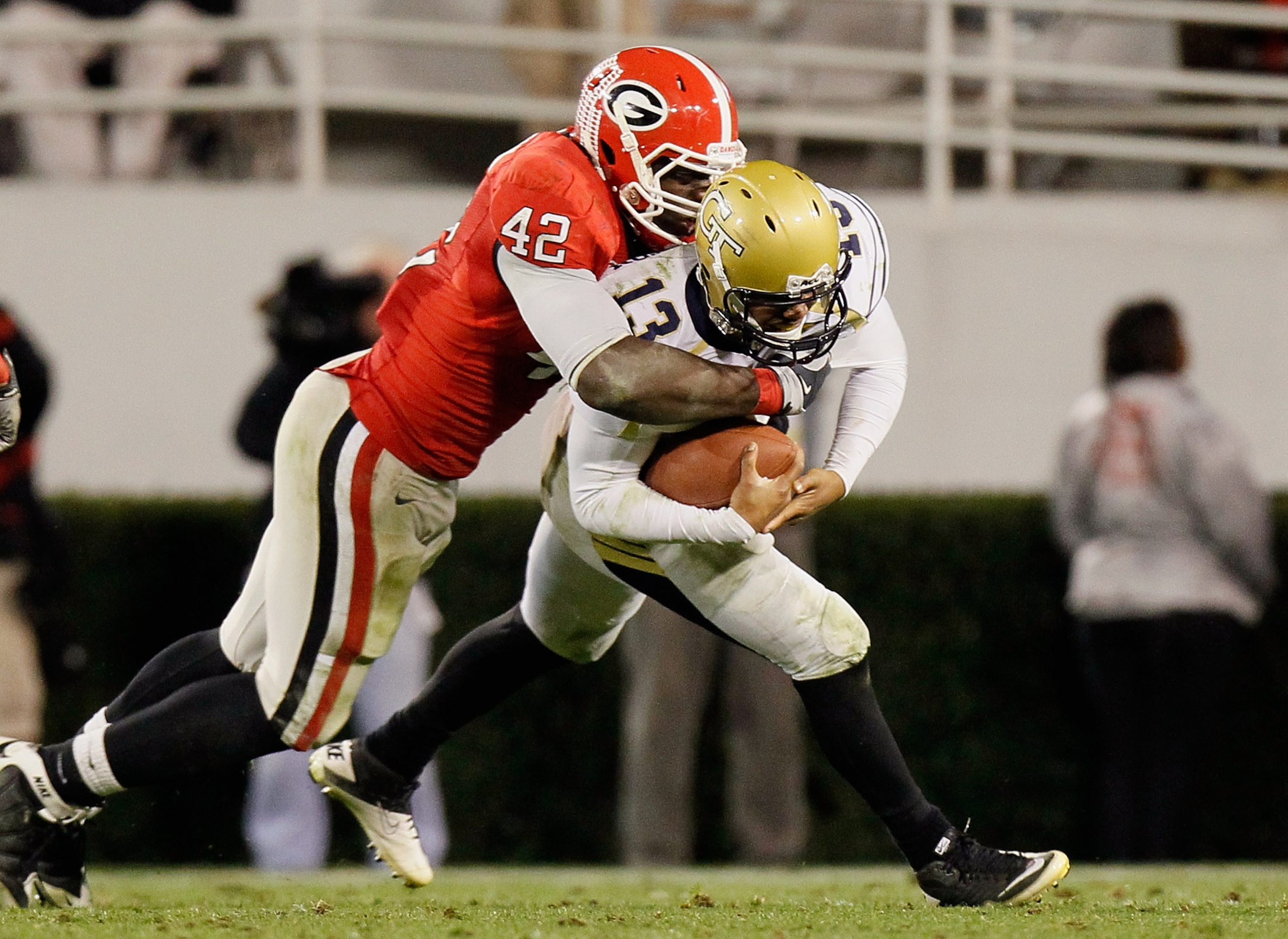 ATHENS, GA - NOVEMBER 27:  Justin Houston #42 of the Georgia Bulldogs sacks quarterback Tevin Washington #13 of the Georgia Tech Yellow Jackets at Sanford Stadium on November 27, 2010 in Athens, Georgia.  (Photo by Kevin C. Cox/Getty Images)