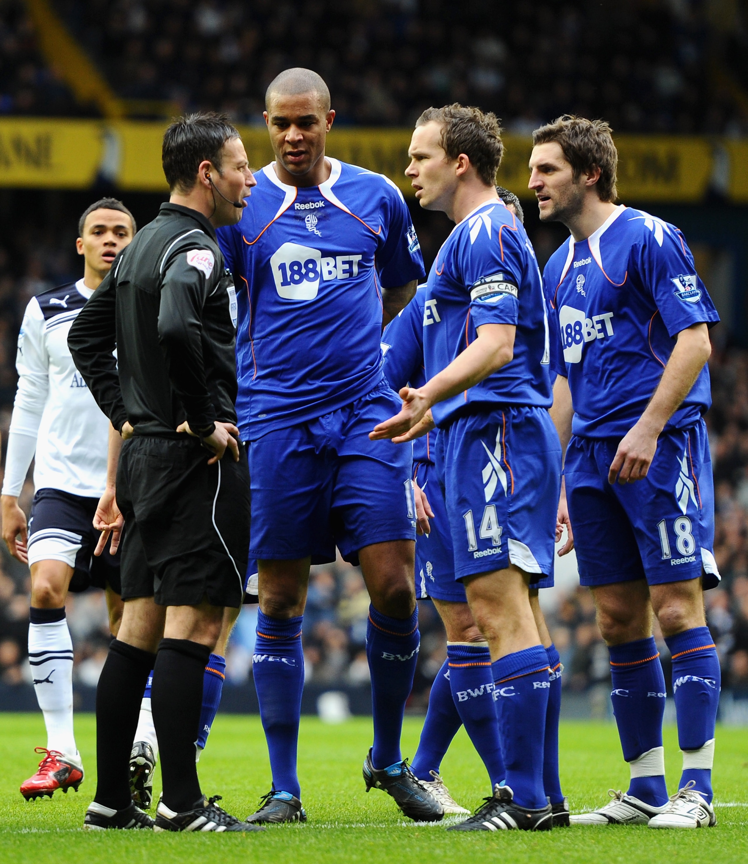 LONDON, ENGLAND - FEBRUARY 05:  Kevin Davies of Bolton Wanderers remonstrates with referee Mark Clattenburg after he handles the ball in the area and Clattenburg awards a penalty kick during the Barclays Premier League match between Tottenham Hotspur and
