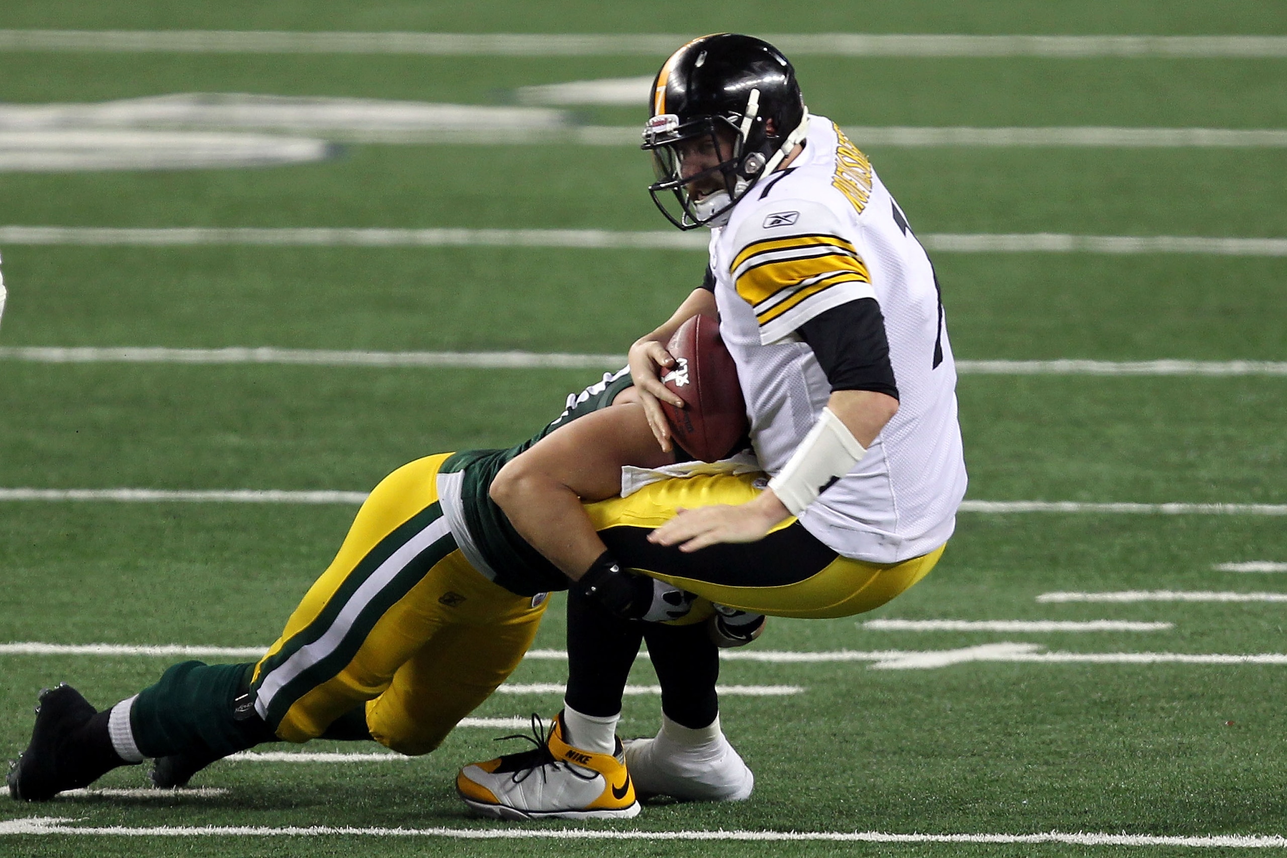 ARLINGTON, TX - FEBRUARY 06: Ben Roethlisberger #7 of the Pittsburgh Steelers is sacked by Frank Zombo #58 of the Green Bay Packers during the second half of Super Bowl XLV at Cowboys Stadium on February 6, 2011 in Arlington, Texas.  (Photo by Mike Ehrman