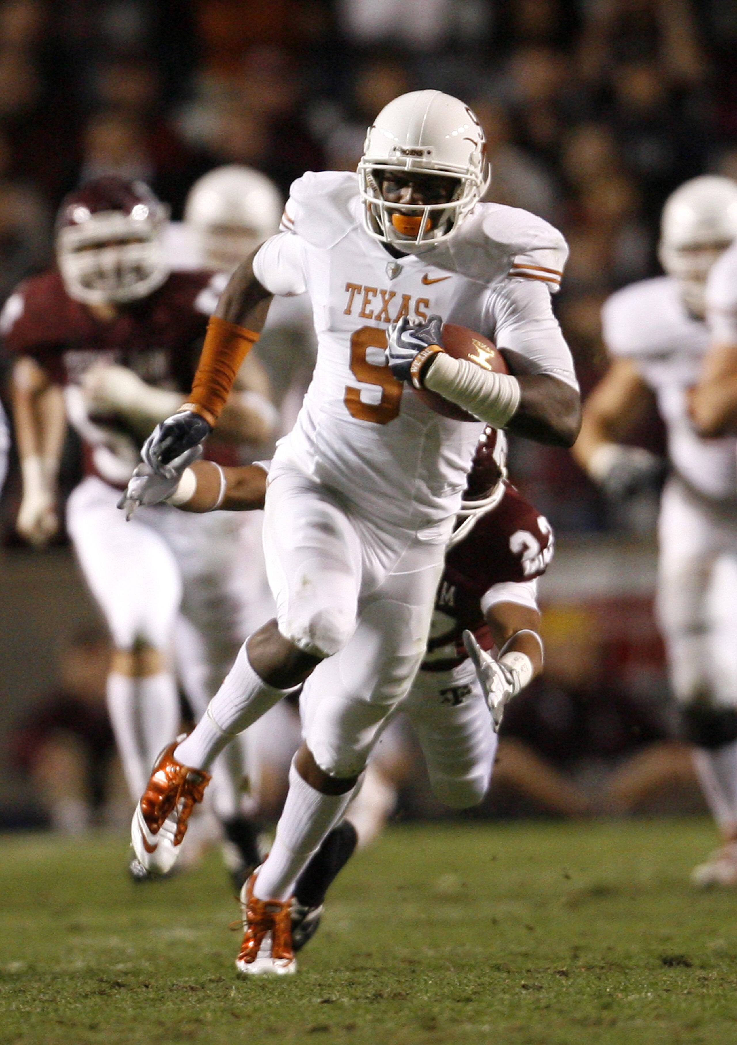 COLLEGE STATION, TX - NOVEMBER 26:  Wide receiver Malcolm Williams #9 of the Texas Longhorns runs for a gain after making a reception against the Texas A&M Aggies in the first half at Kyle Field on November 26, 2009 in College Station, Texas. The Longhorn