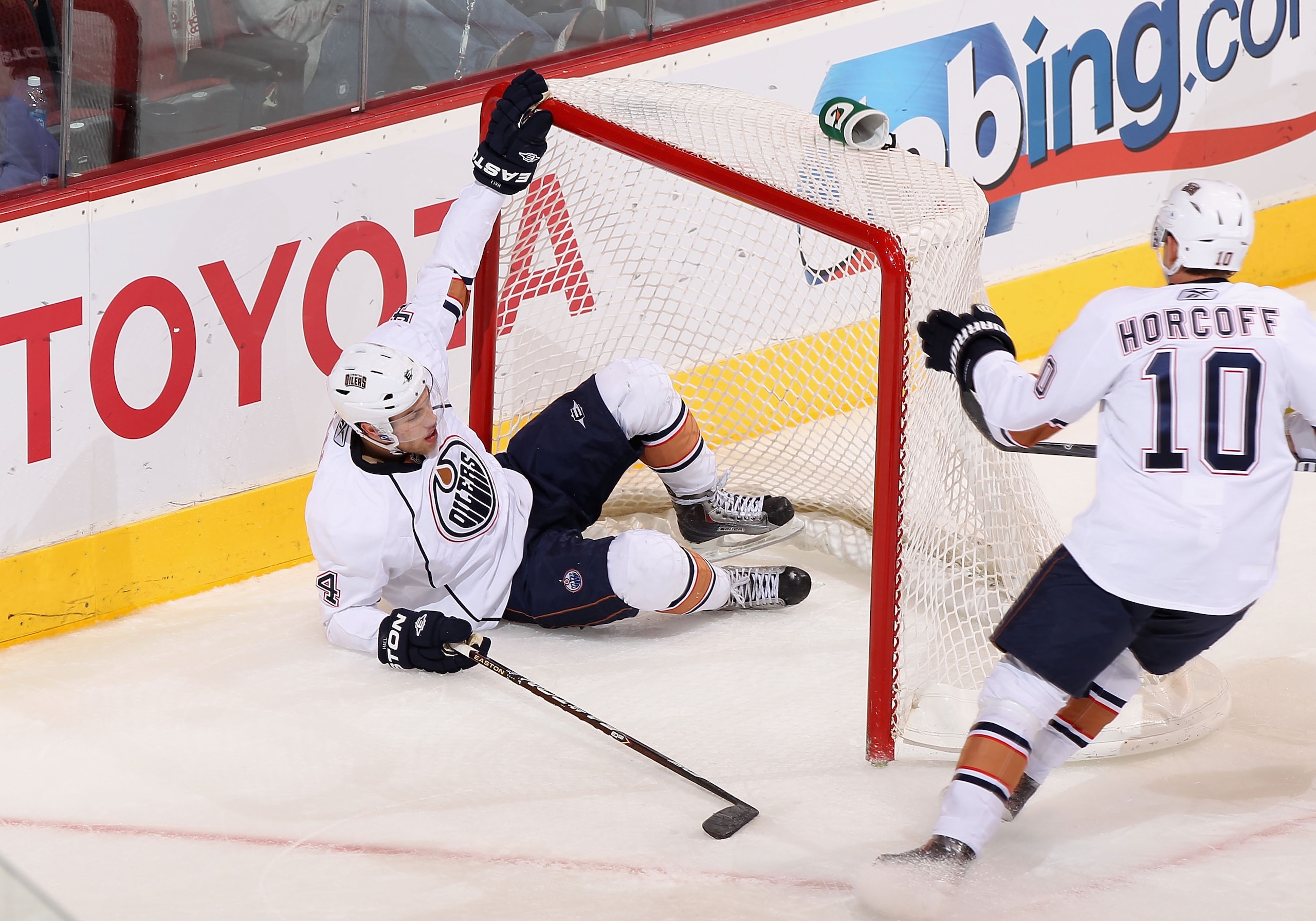 GLENDALE, AZ - JANUARY 25:  Taylor Hall #4 of the Edmonton Oilers crashes into the net during the NHL game against the Phoenix Coyotes at Jobing.com Arena on January 25, 2011 in Glendale, Arizona.  The Oilers defeated the Coyotes 4-3.  (Photo by Christian