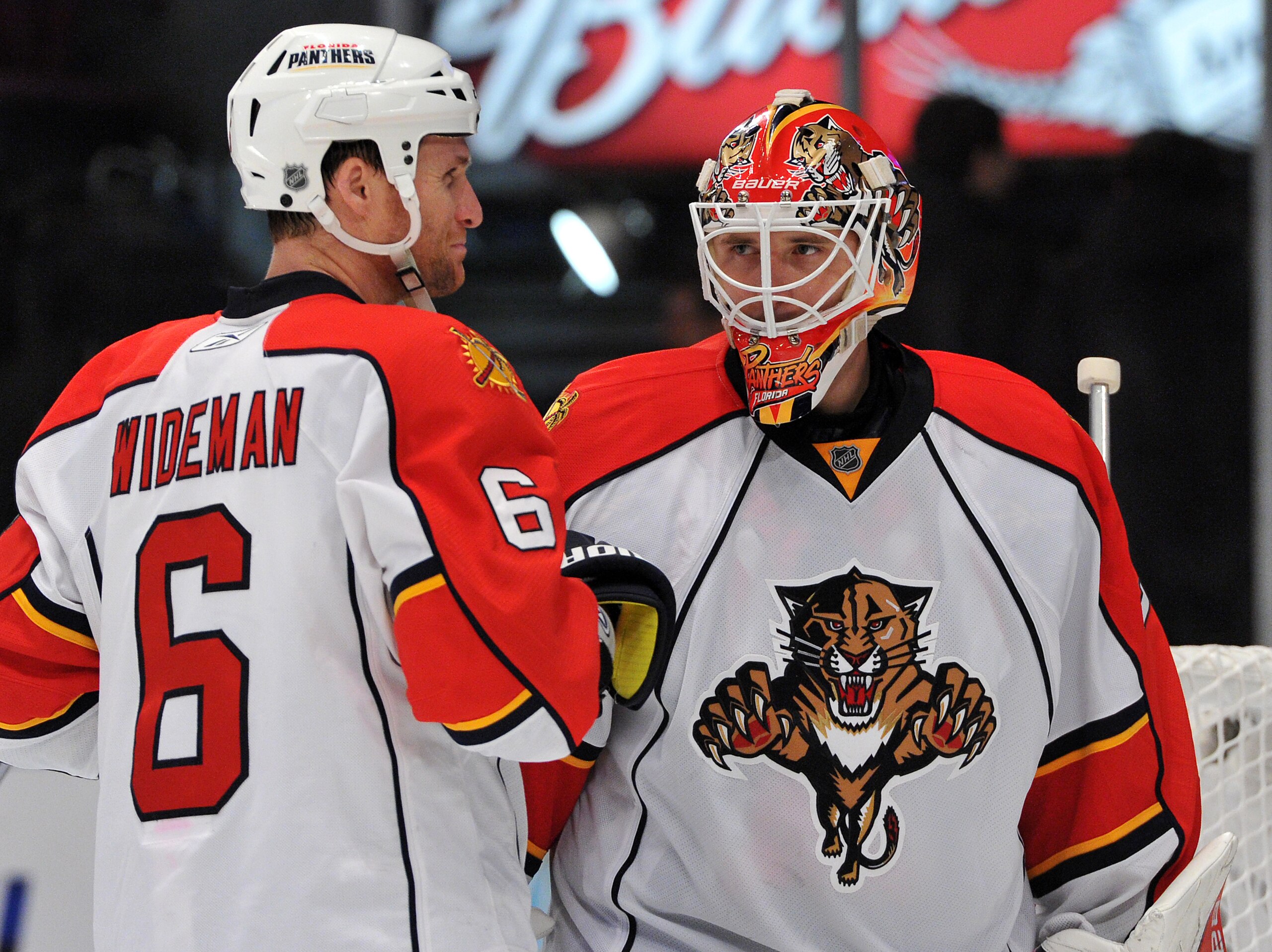 NEW YORK, NY - JANUARY 25: Tomas Vokoun #29 of the Florida Panthers is congratulated by Dennis Wideman #6 after defeating the New York Rangers 4-3 at Madison Square Garden on January 25, 2011 in New York City. The Panthers defeated the 4-3. (Photo by Chri