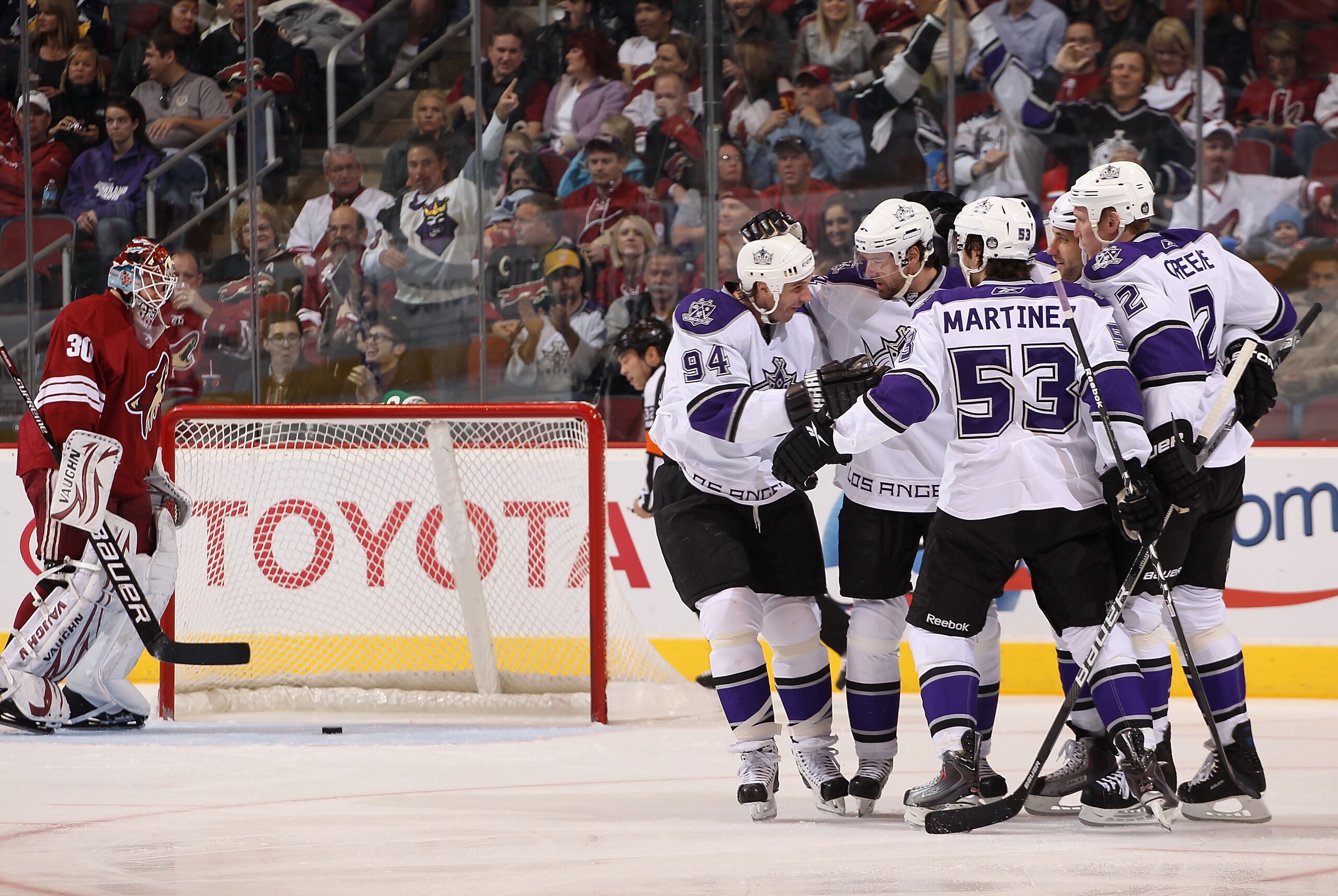 GLENDALE, AZ - JANUARY 22:  Ryan Smyth #94, Justin Williams #14, Alec Martinez #53, Willie Mitchell #33 and Matt Greene #2 of the Los Angeles Kings celebrate after Williams scored a first period goal against goaltender Ilya Bryzgalov #30 of the Phoenix Co
