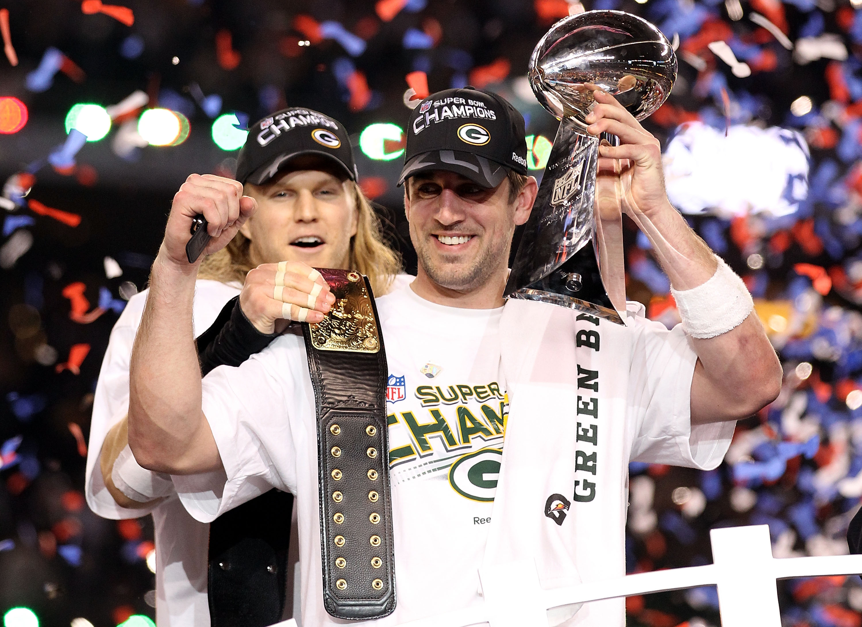 ARLINGTON, TX - FEBRUARY 06:  Super Bowl MVP Aaron Rodgers #12 of the Green Bay Packers holds up the Vince Lombardi Trophy as Clay Matthews #52 looks on after winning Super Bowl XLV 31-25 against the Pittsburgh Steelers at Cowboys Stadium on February 6, 2