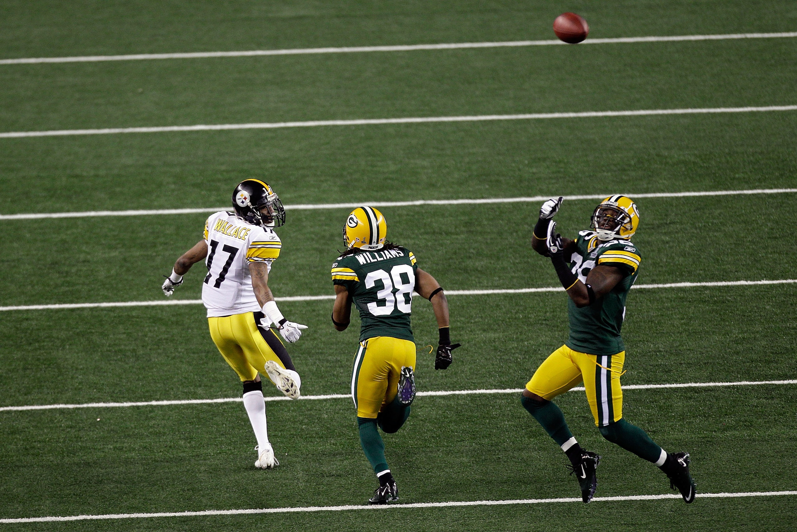 ARLINGTON, TX - FEBRUARY 06:  Nick Collins #36 of the Green Bay Packers makes an interception and runs 37 yards for a touchdown in the first quarter against the Pittsburgh Steelers during Super Bowl XLV at Cowboys Stadium on February 6, 2011 in Arlington,
