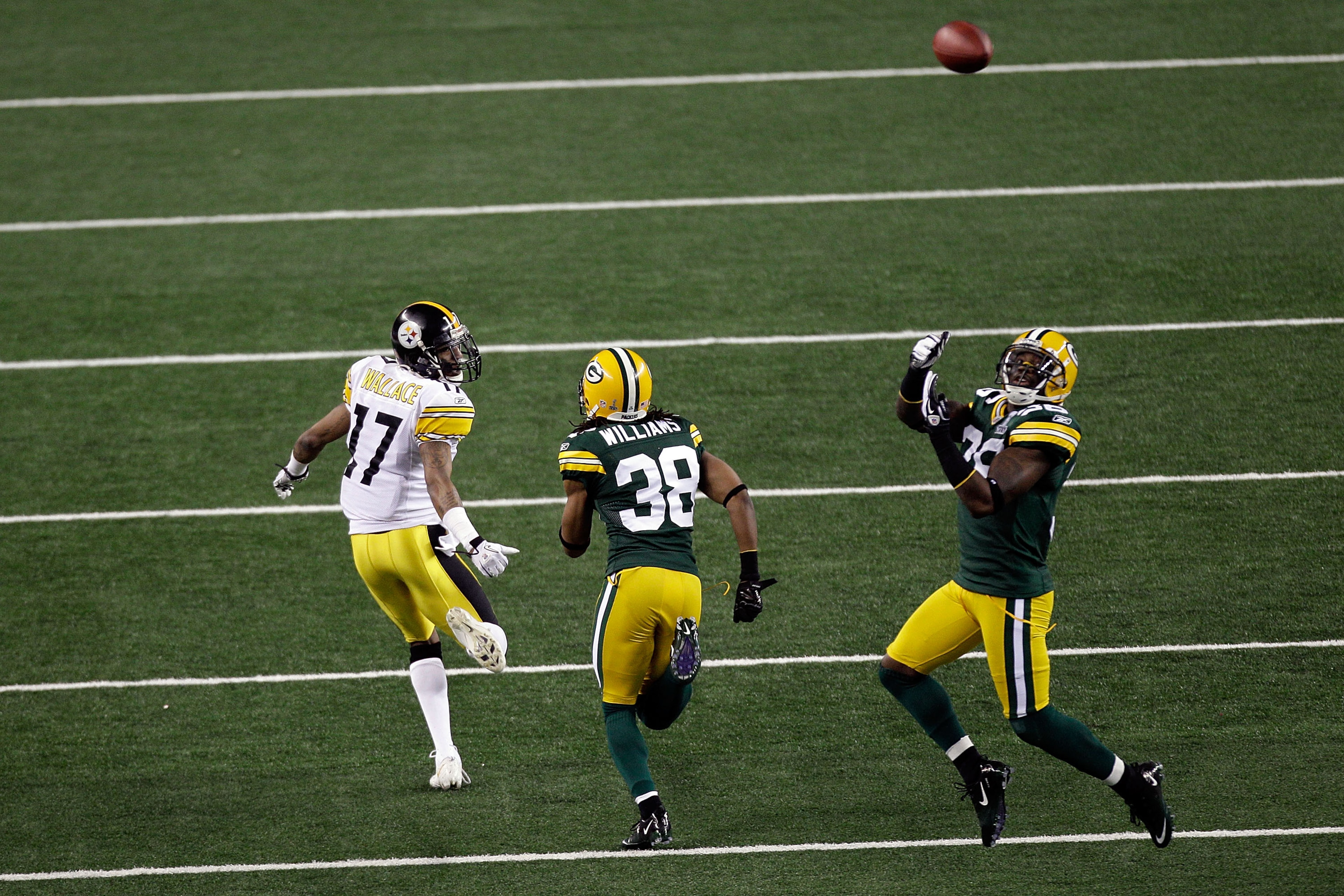 ARLINGTON, TX - FEBRUARY 06:  Nick Collins #36 of the Green Bay Packers makes an interception and runs 37 yards for a touchdown in the first quarter against the Pittsburgh Steelers during Super Bowl XLV at Cowboys Stadium on February 6, 2011 in Arlington,
