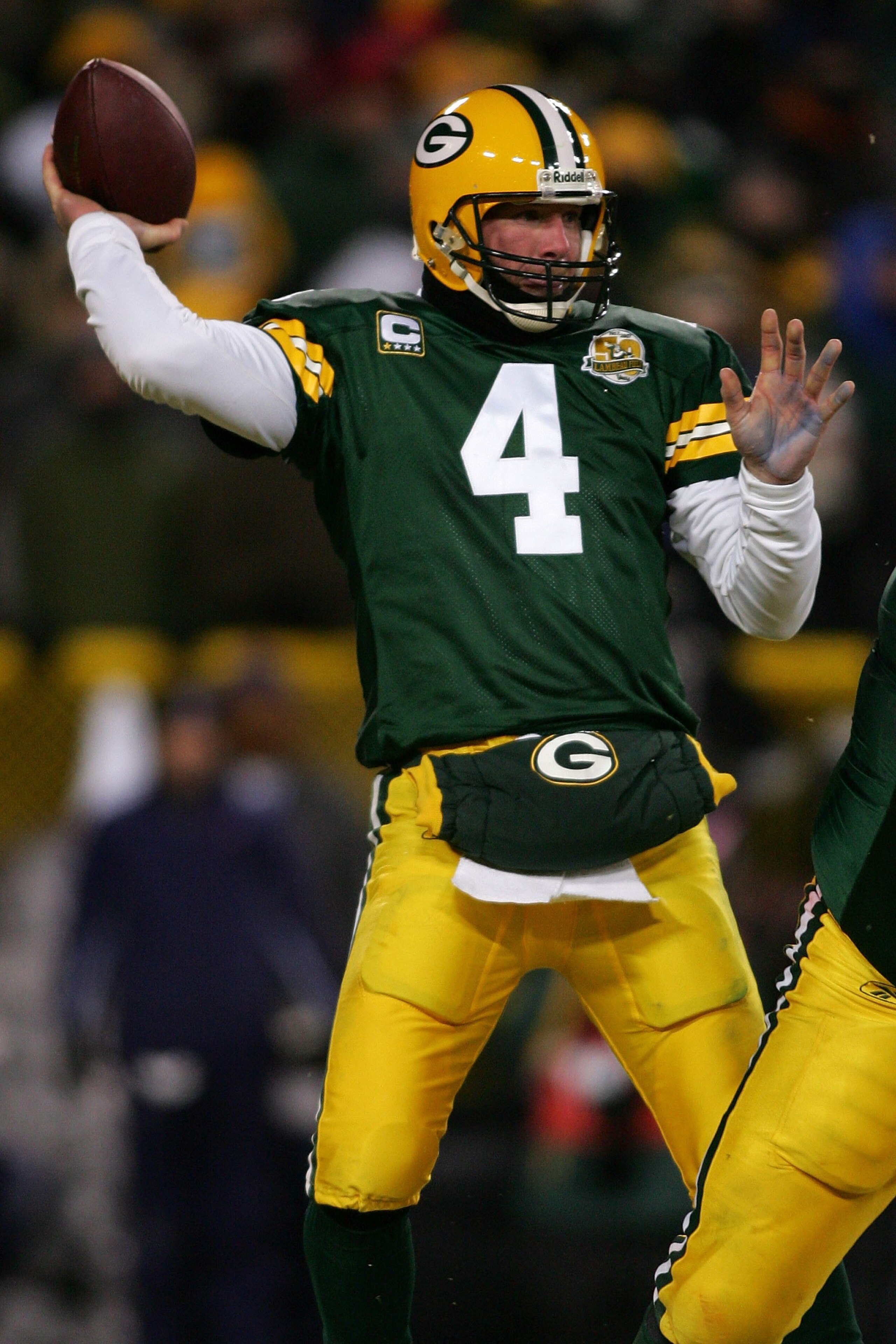 GREEN BAY, WI - JANUARY 20:  Quarterback Brett Favre #4 of the Green Bay Packers throws the ball during the NFC championship game against the New York Giants on January 20, 2008 at Lambeau Field in Green Bay, Wisconsin. The Giants defeated the Packers 23-