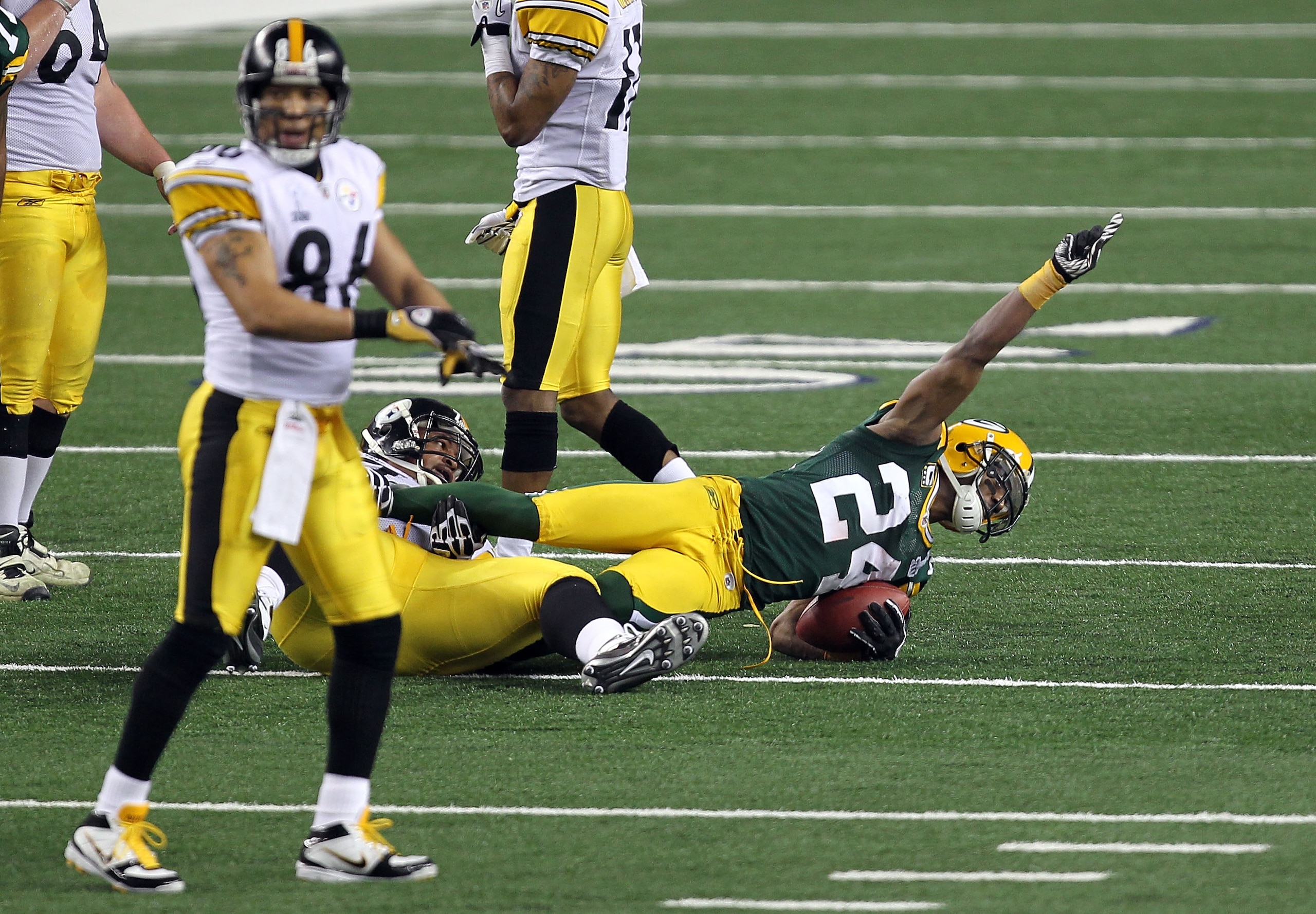 ARLINGTON, TX - FEBRUARY 06: Jarrett Bush #24 of the Green Bay Packers reacts after catching an interception against the Pittsburgh Steelers during Super Bowl XLV at Cowboys Stadium on February 6, 2011 in Arlington, Texas. (Photo by Mike Ehrmann/Getty Im ARLINGTON, TX - FEBRUARY 06: Jarrett Bush #24 of the Green Bay Packers reacts after catching an interception against the Pittsburgh Steelers during Super Bowl XLV at Cowboys Stadium on February 6, 2011 in Arlington, Texas. (Photo by Mike Ehrmann/Getty Im